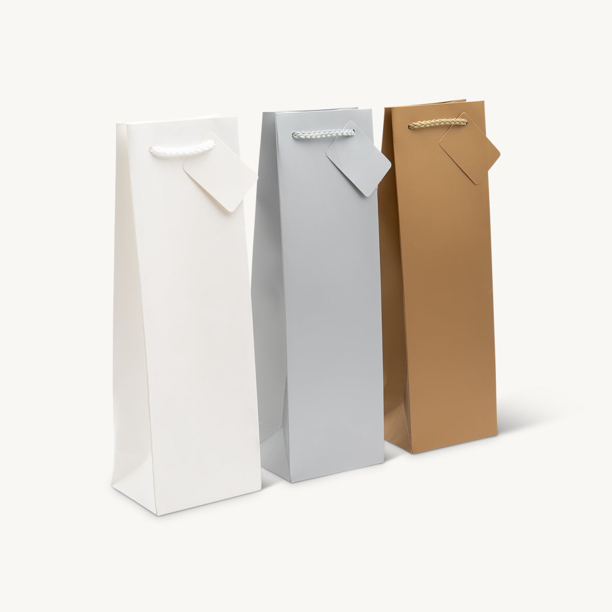 1 Bottle laminated gift bag featuring a patterned finish and heavy-duty handles.