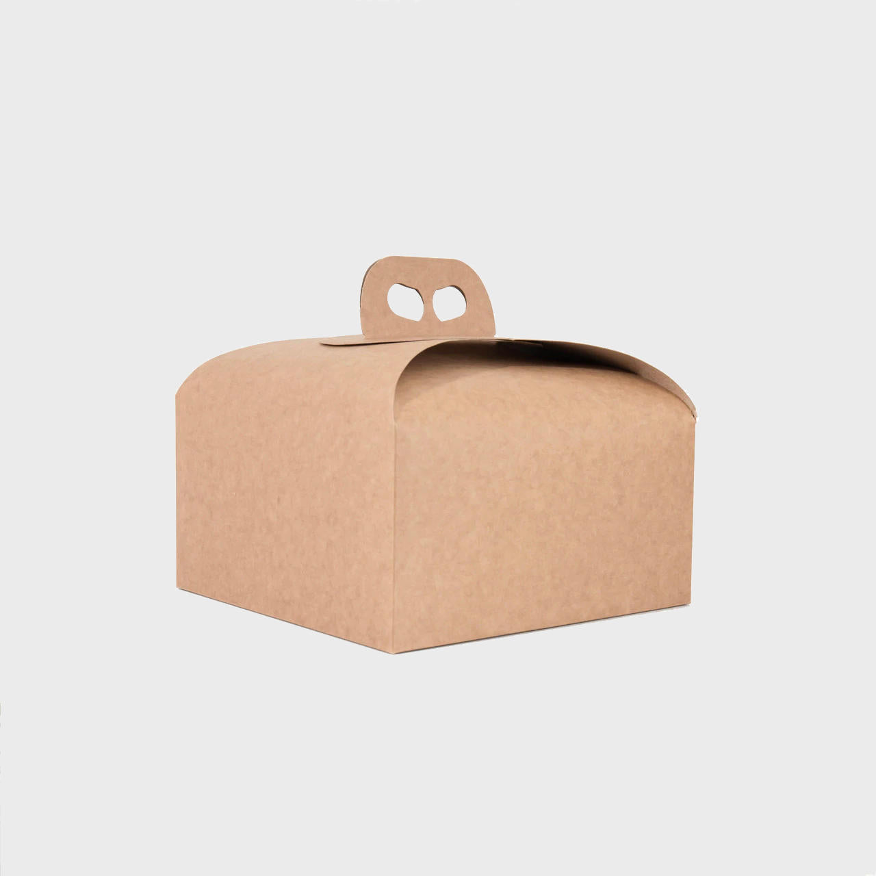 Kraft cake or panettone gift box with carrier handle from high-density rigid paperboard.