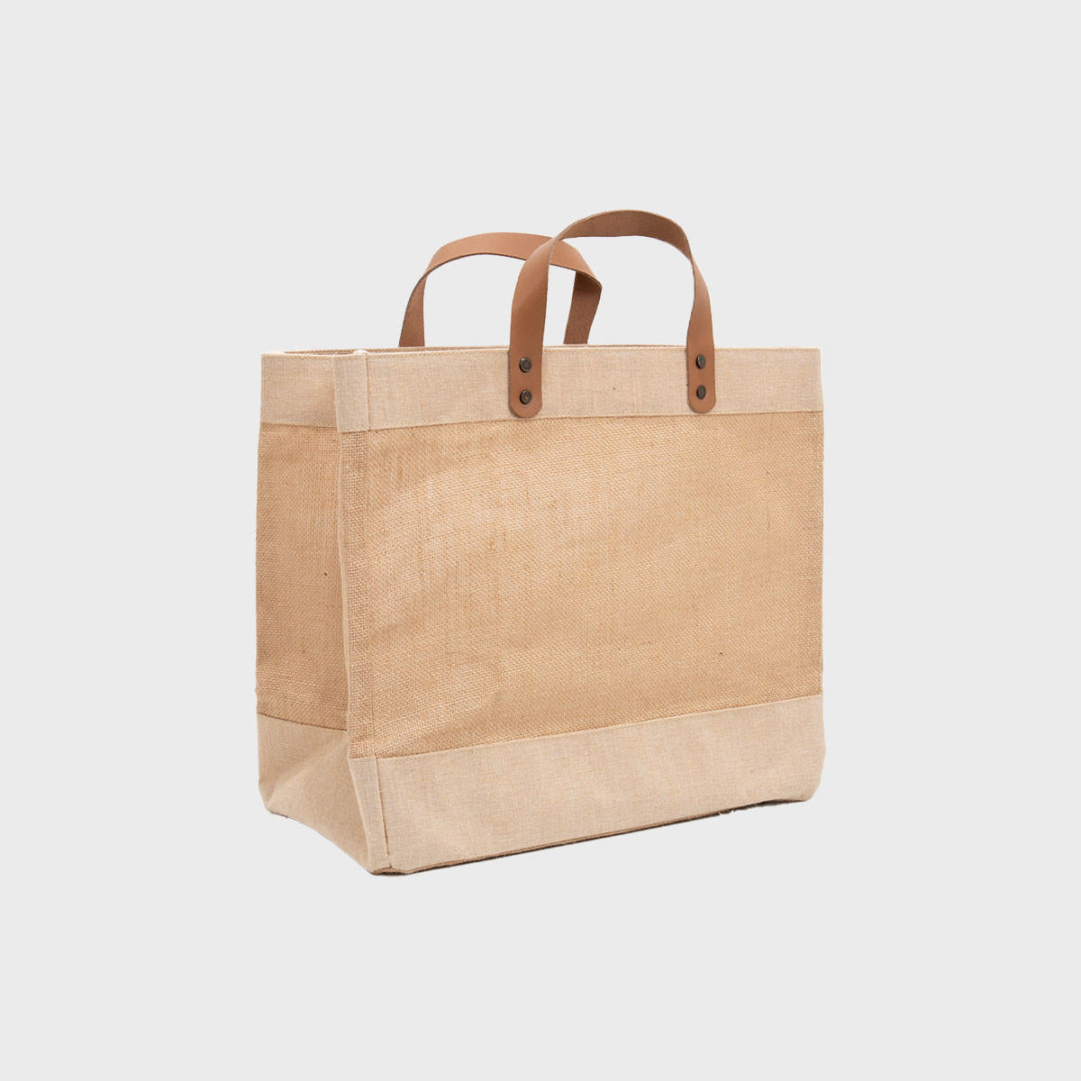 Large natural jute market bag with leather handles.