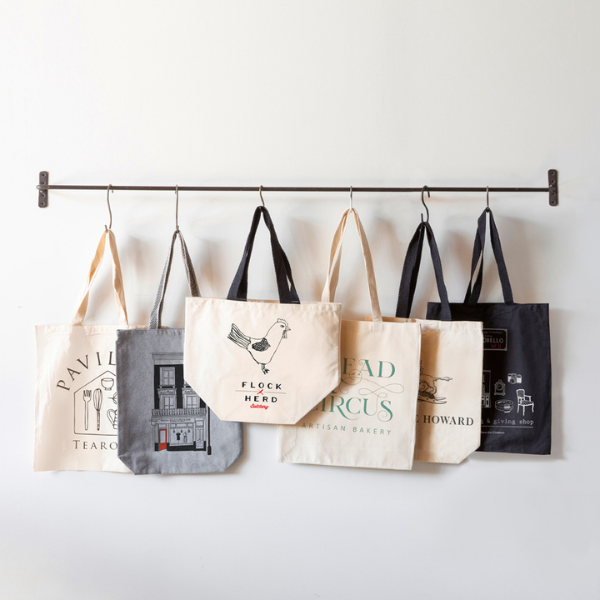 Use branded totes to enhance the shopping experience.