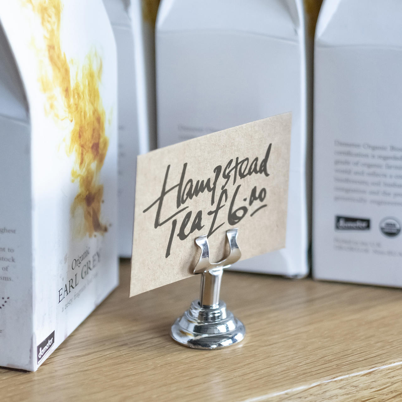 40mm chrome ticket holder with a clean surface for visible retail messaging.
