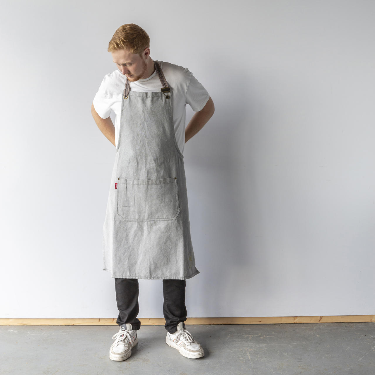 12oz light grey recycled canvas hospitality apron tailored from heavy canvas with reinforcing seams.