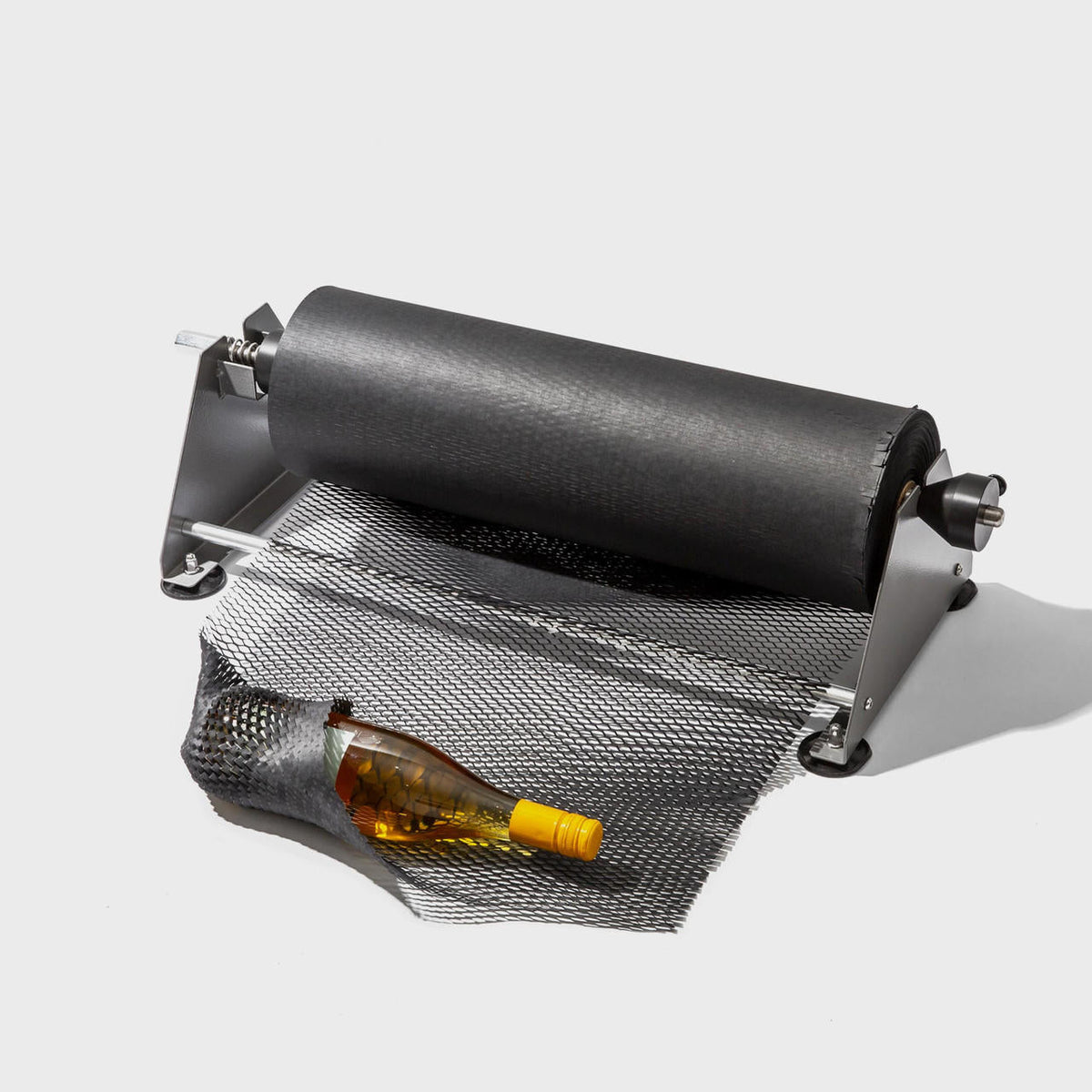 Honeycomb paper dispenser with 150m black honeycomb paper roll.