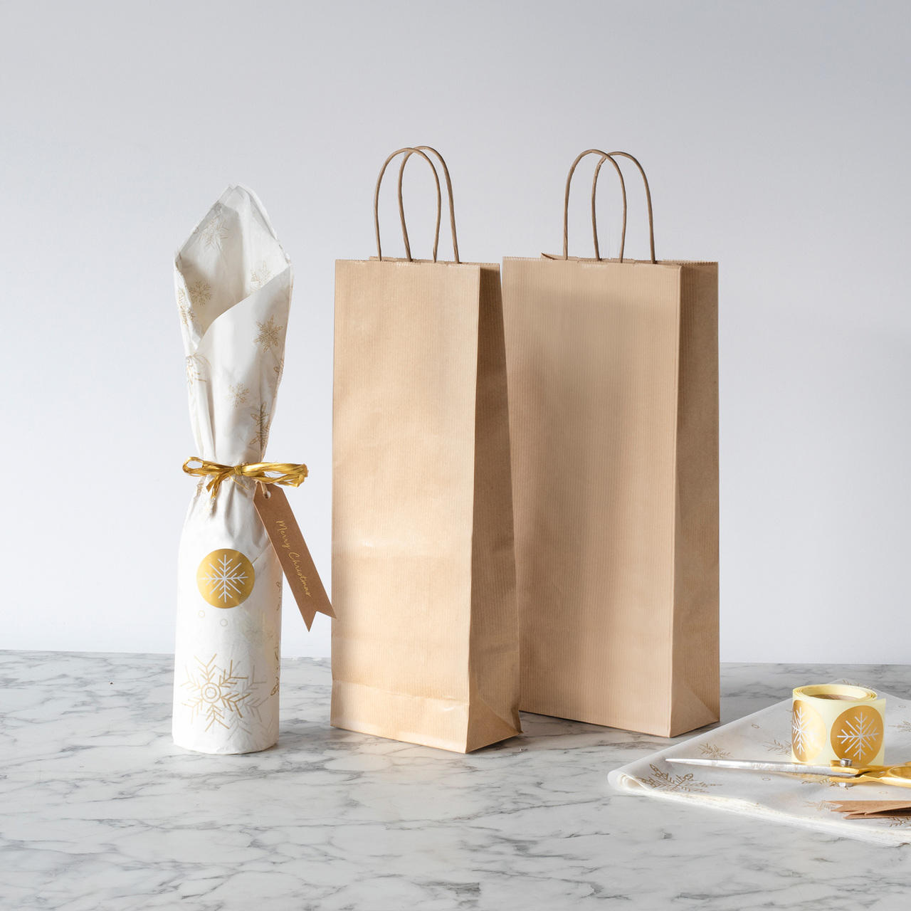 Kraft paper bottle gift bag with twist handles featuring a patterned finish and heavy-duty handles.