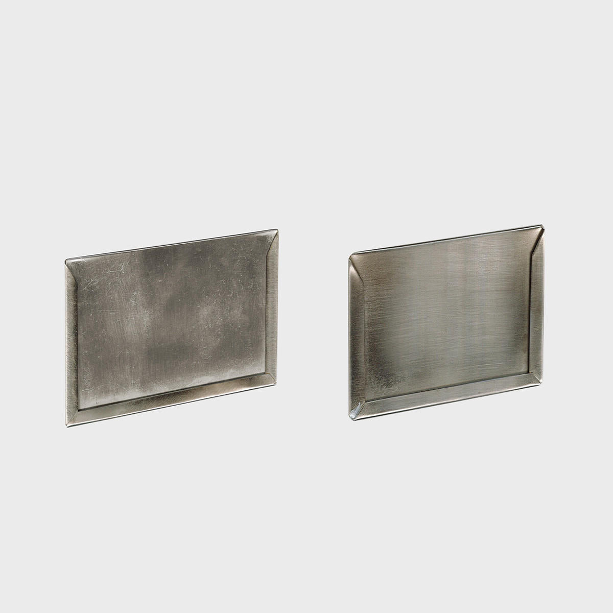 Self adhesive silver card holder.