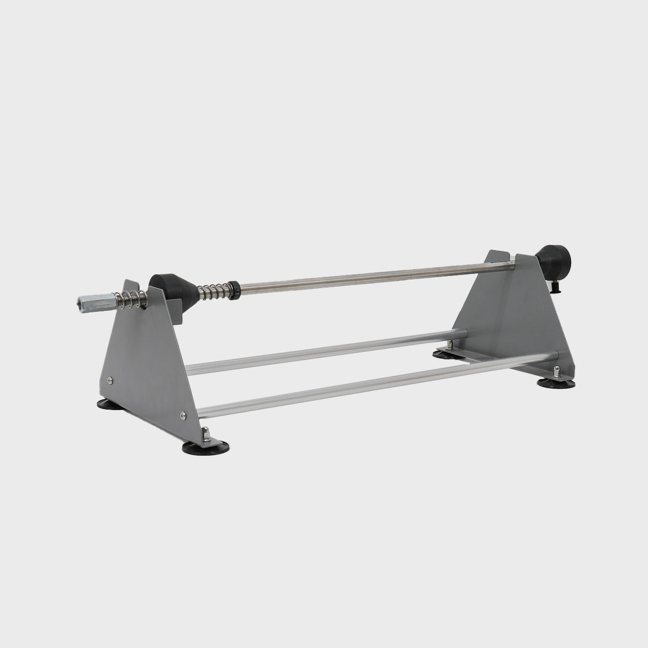 A heavy-duty honeycomb paper dispenser with a metal base and turning wheel.