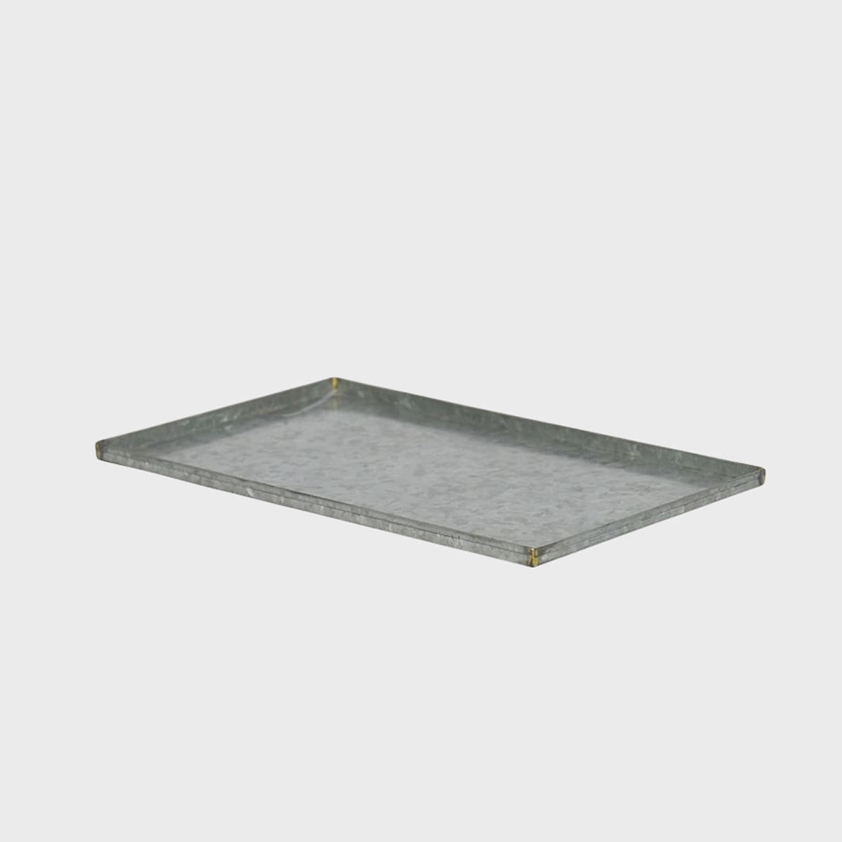 A metal serving platter with a textured surface.
