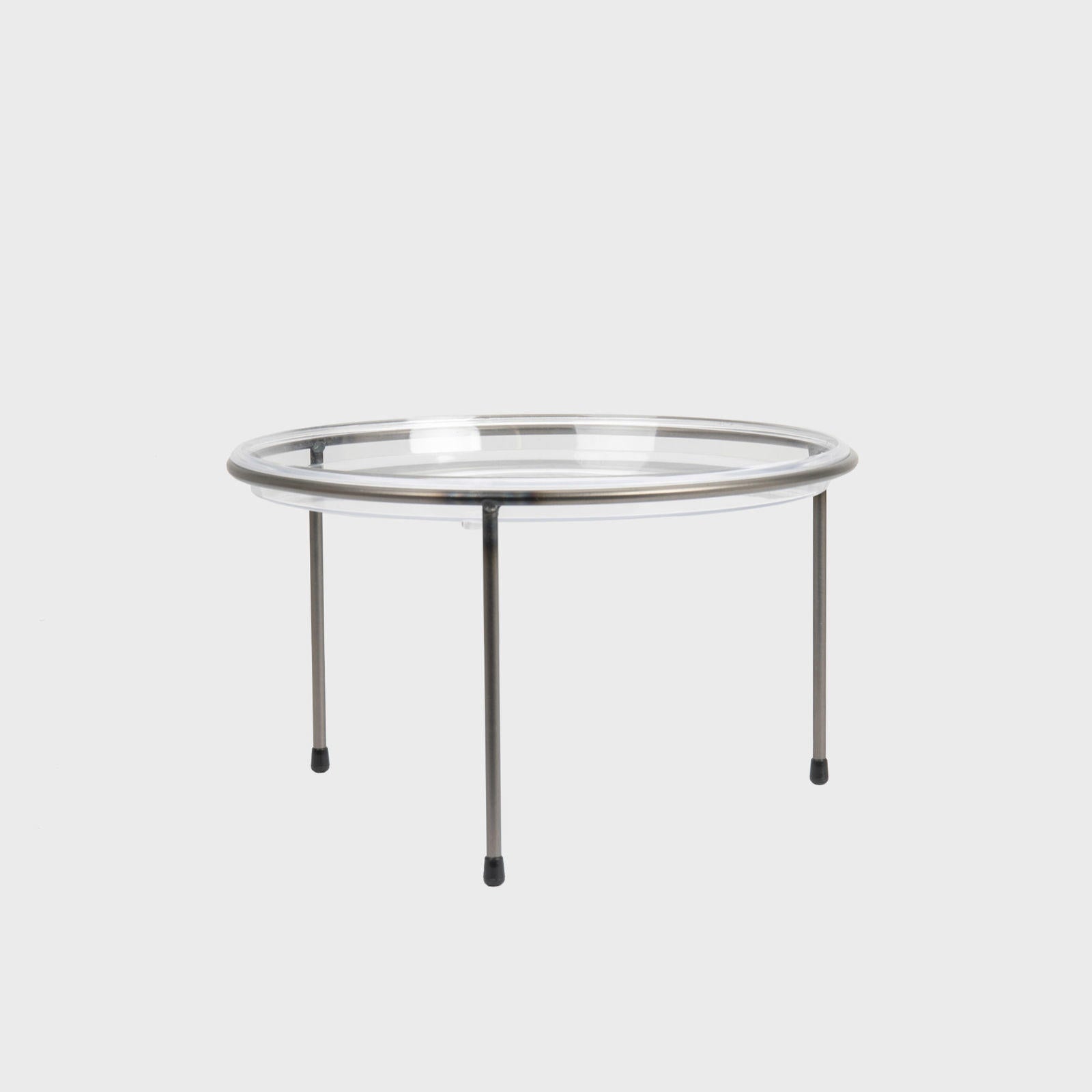 A silver metal tripod riser with a clear acrylic dome countertop stand on a white background.