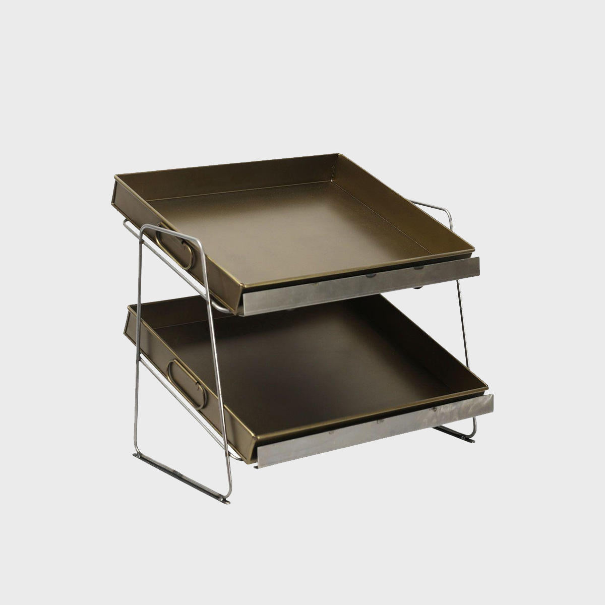 A set of two-tiered countertop display units with medium brass metal trays.