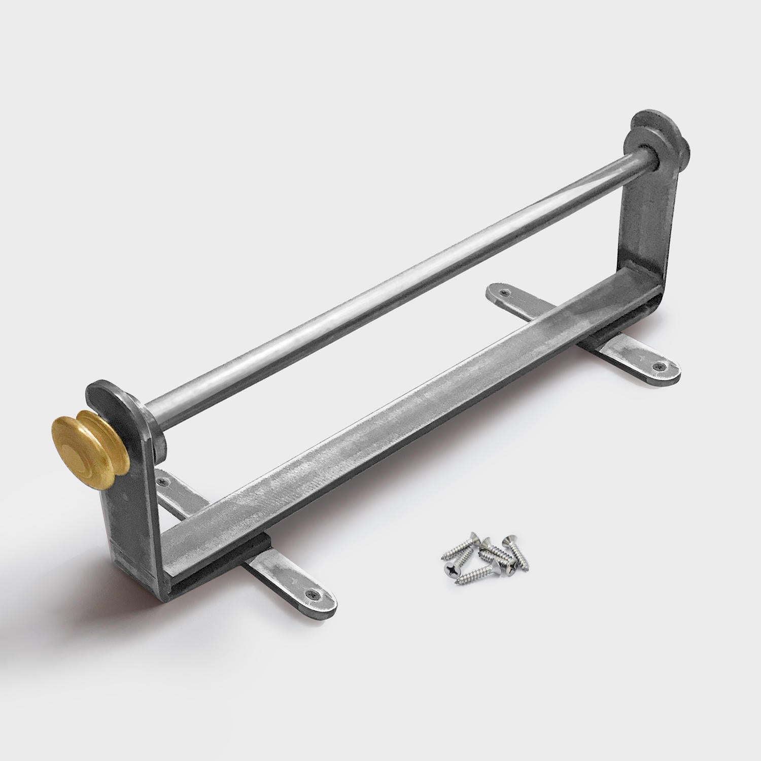 A wall-mounted metal paper dispenser with a silver finish and a gold colored adjustment knob.