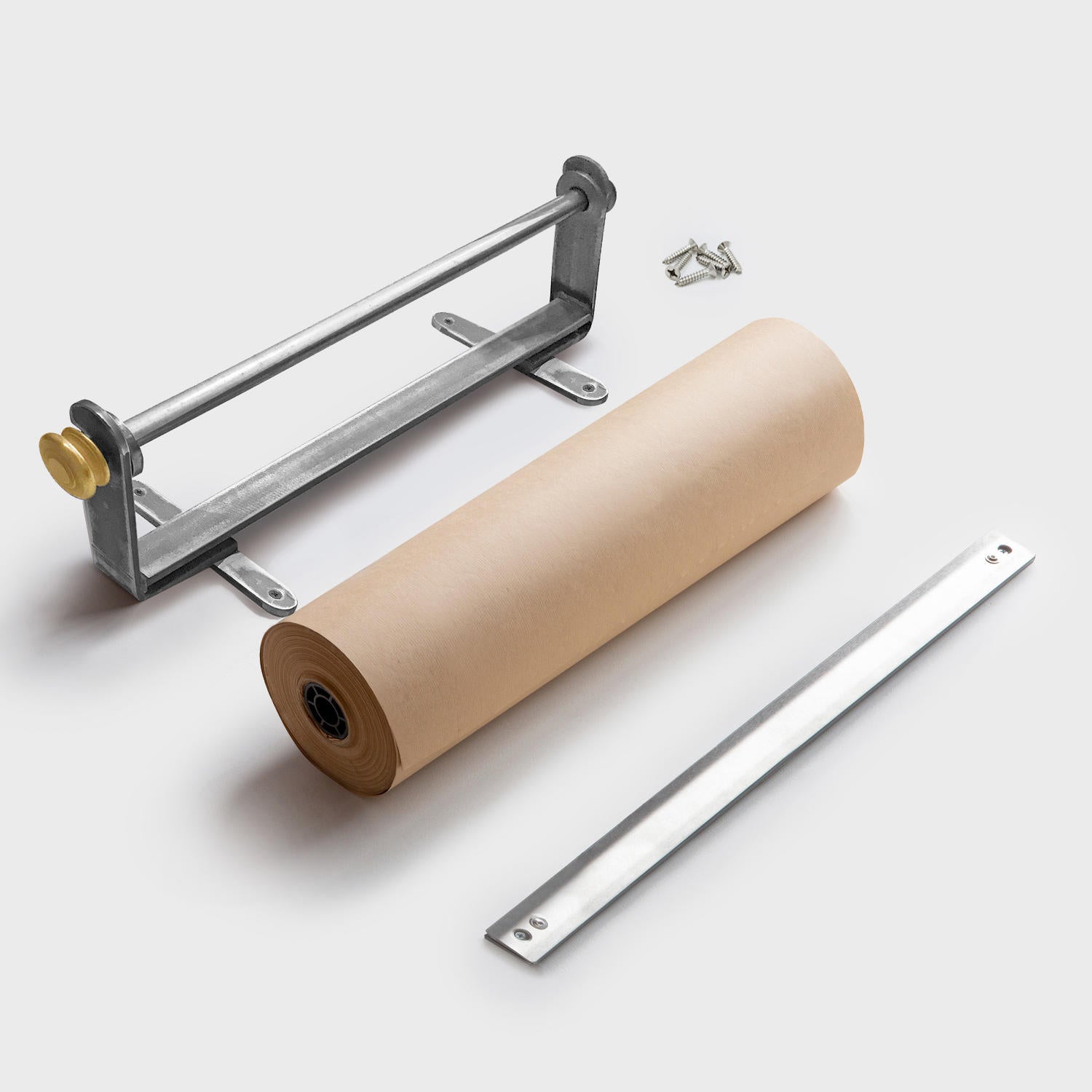 A wall-mounted metal paper dispenser with a silver finish and a gold colored adjustment knob on a white background.