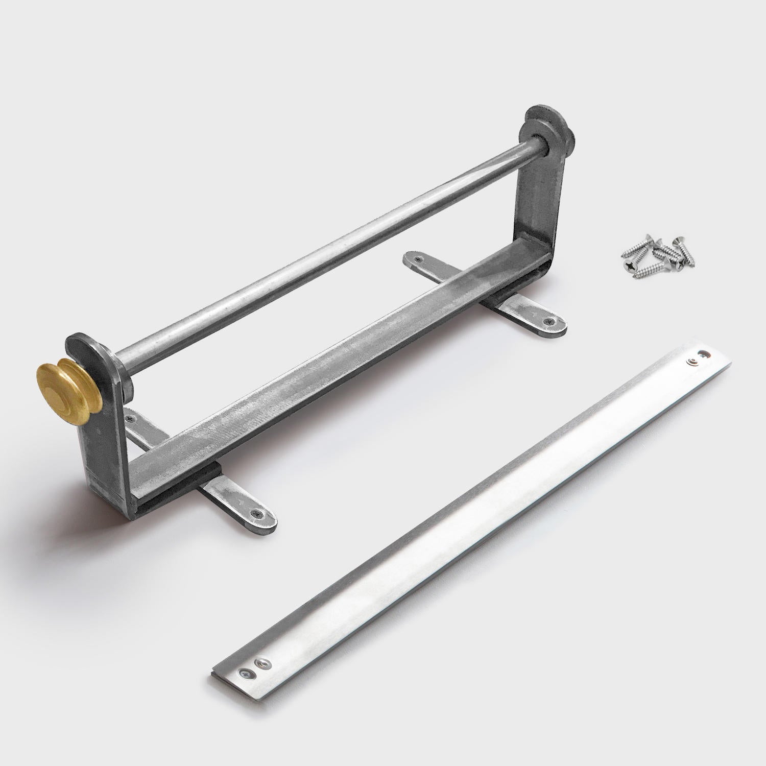 A wall mounted metal paper dispenser with a silver finish and a gold colored adjustment knob.