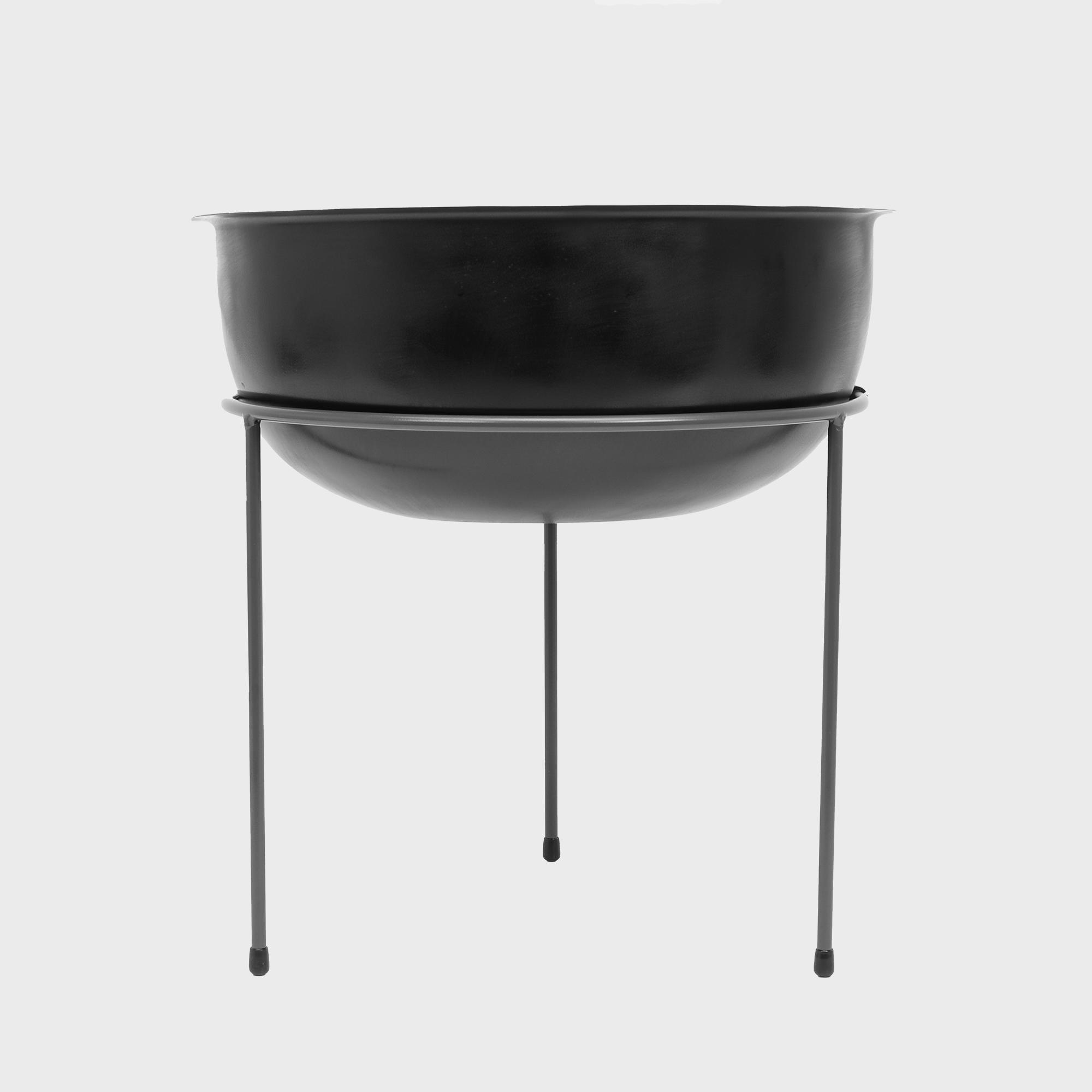 A set of black metal risers with bowls, designed for displaying items at various angles.