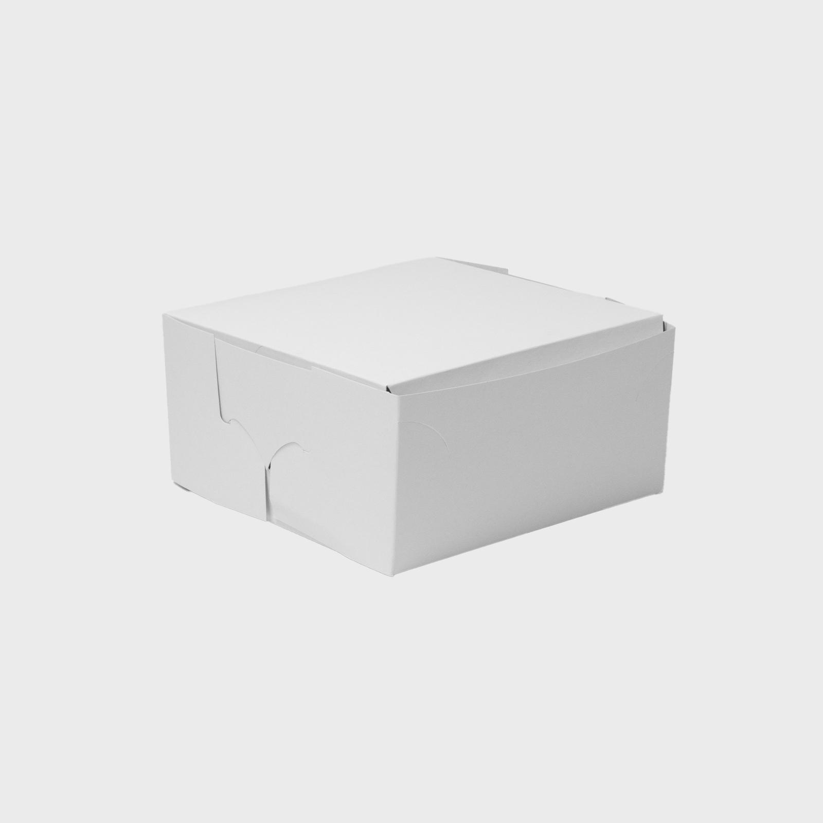 Stacked white rectangular cardboard bakery boxes.