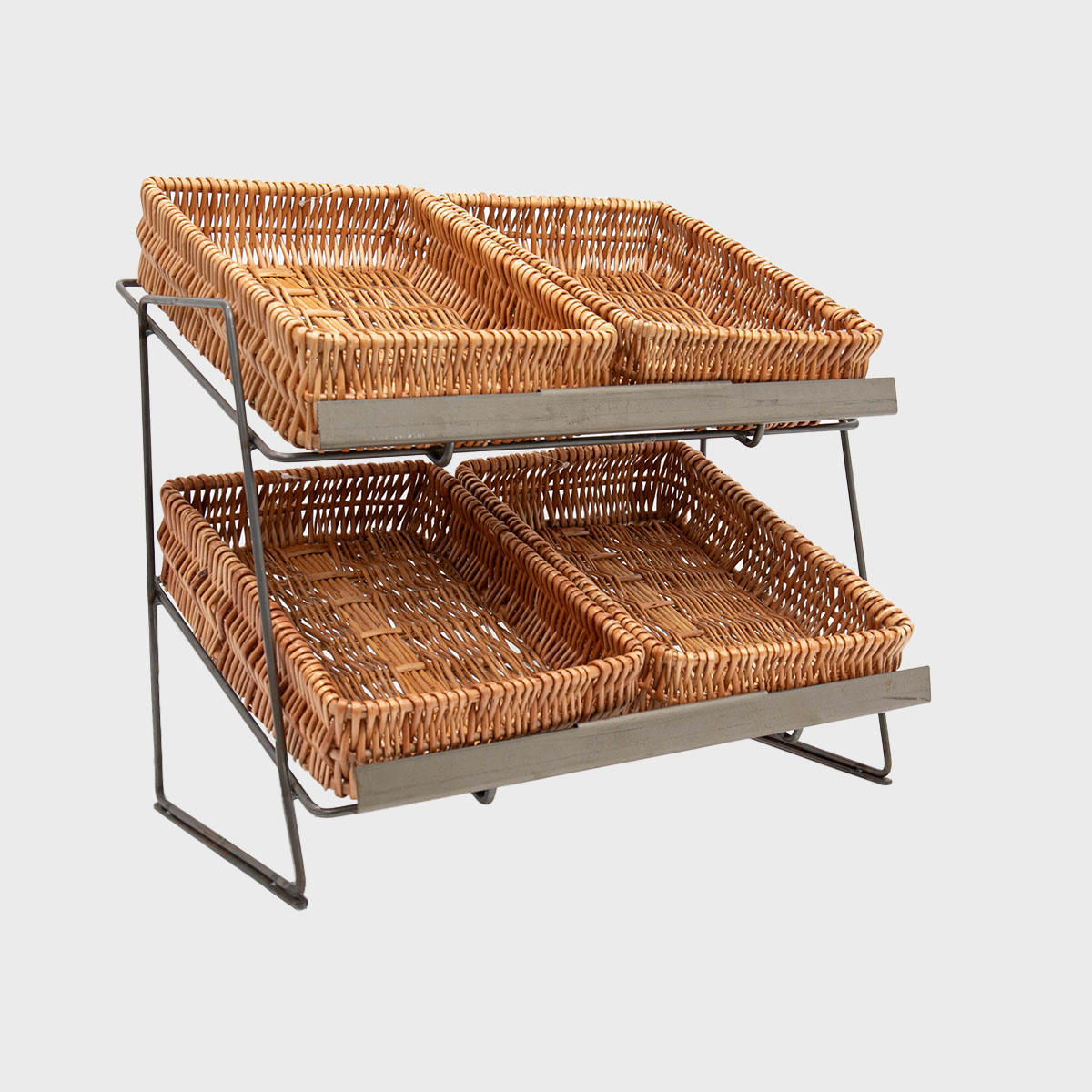 A tiered metal countertop display unit with small natural wicker trays arranged on it.