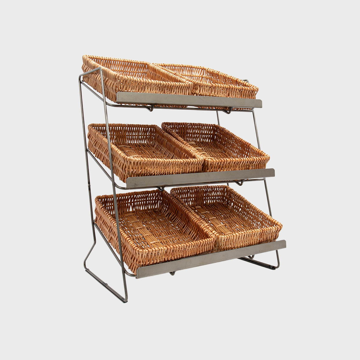 A tiered metal countertop display unit with small natural wicker trays arranged on it.