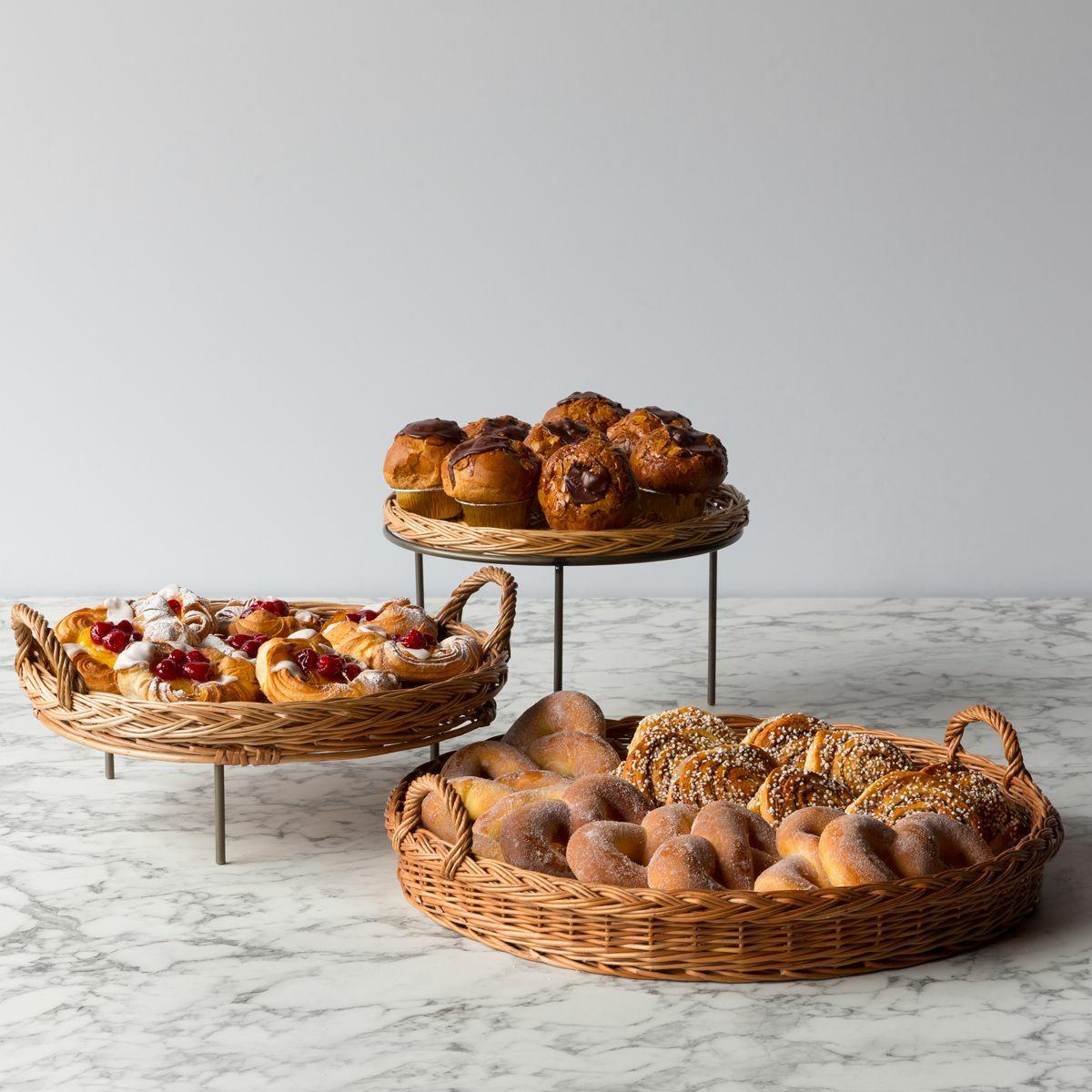 Matlock countertop stand with wicker tray with structured, low-profile walls and open-top design.
