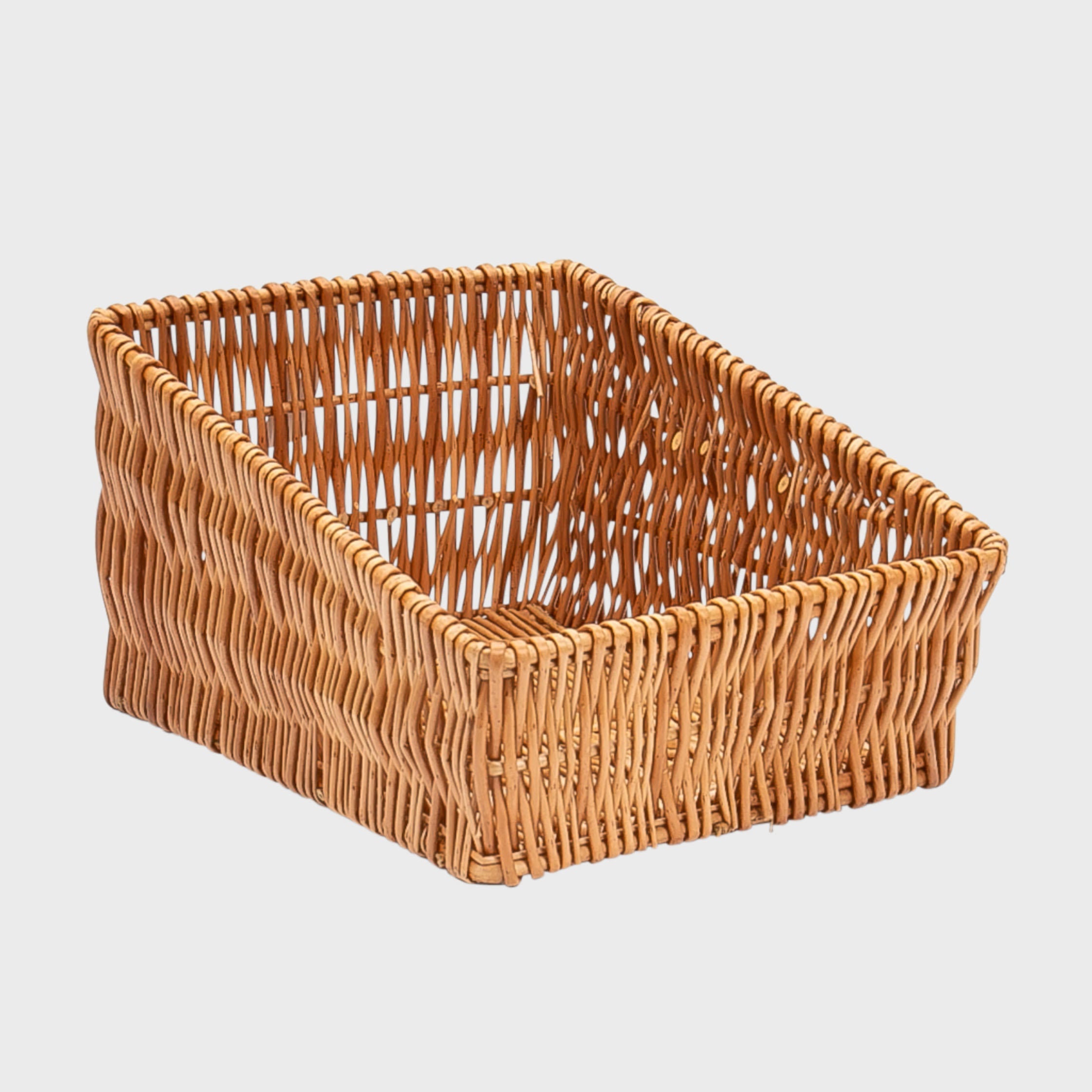 Medium deep angled wicker basket hand-woven from natural split-wicker.