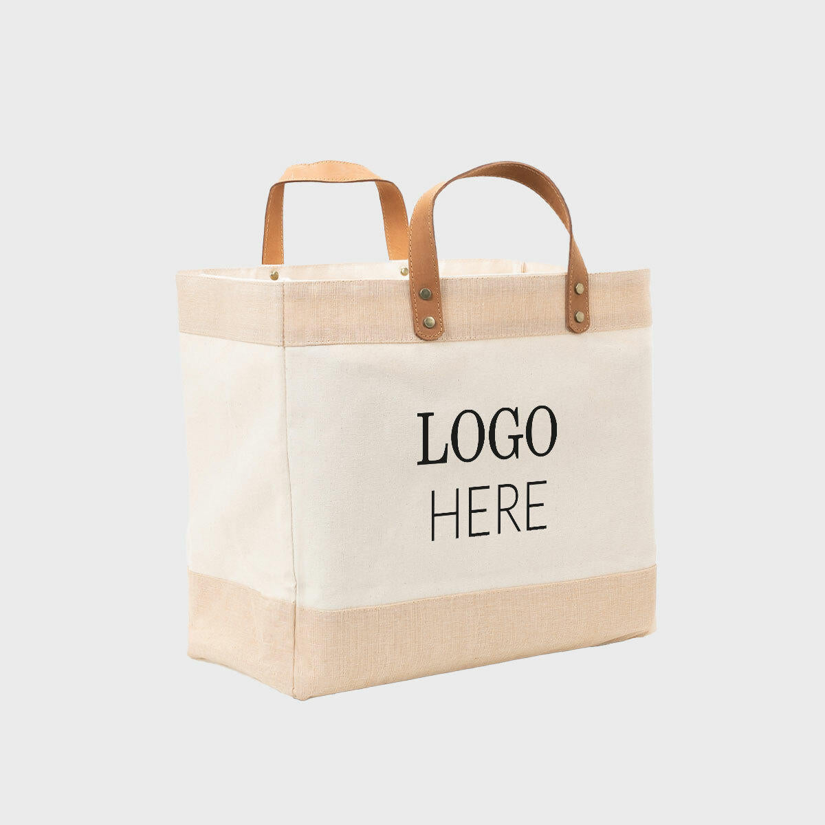 Large natural canvas market bag with leather handles.