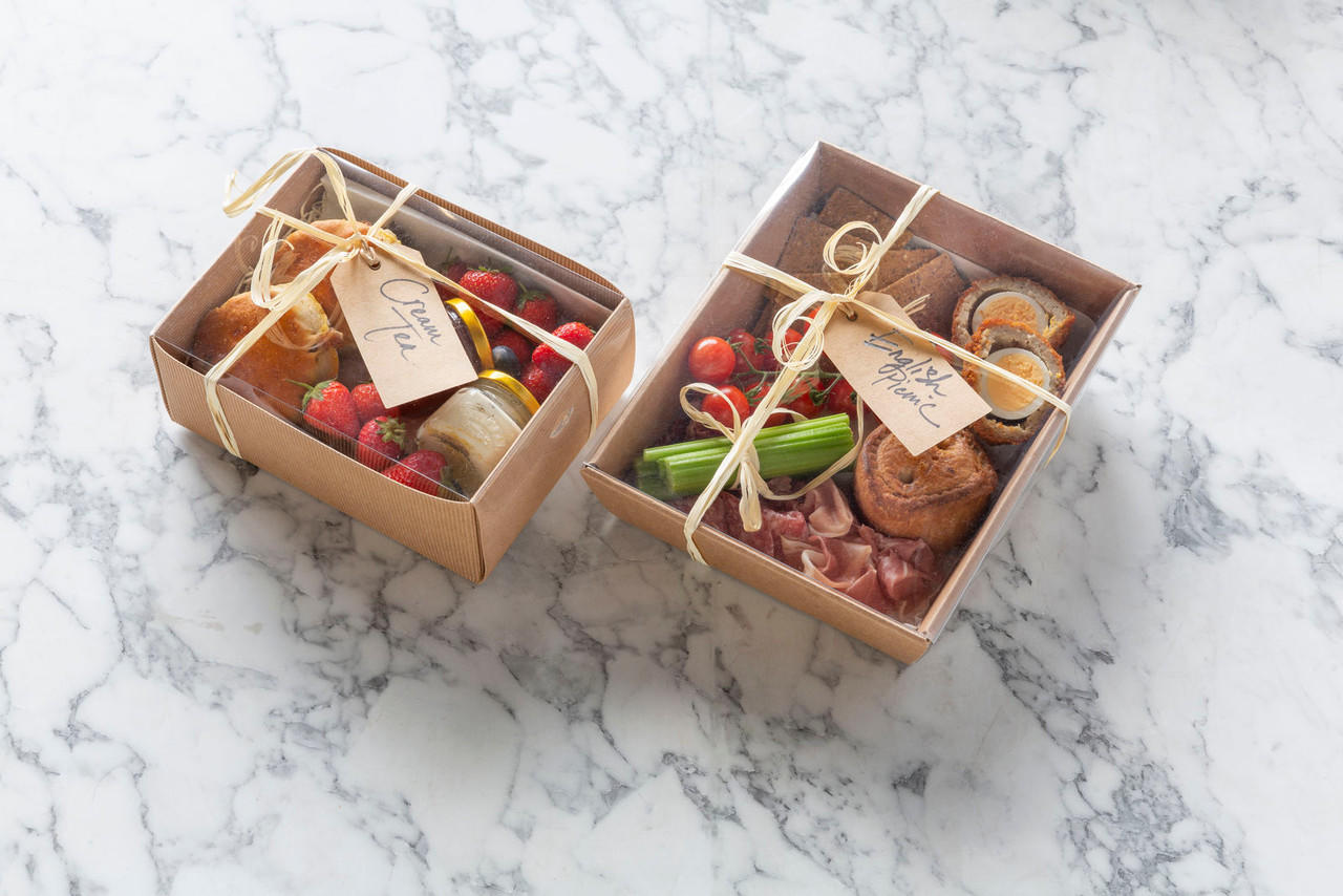 Kraft gift box with clear lid from high-density rigid paperboard.