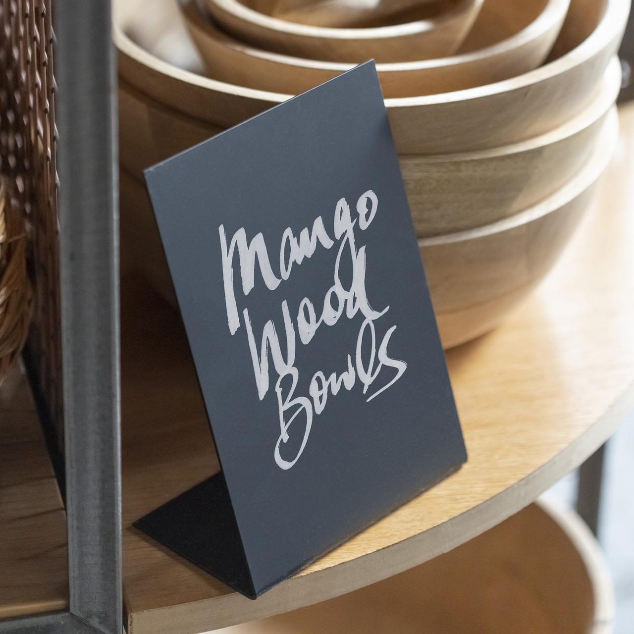 L-shaped table chalkboard with a clean surface for visible retail messaging.