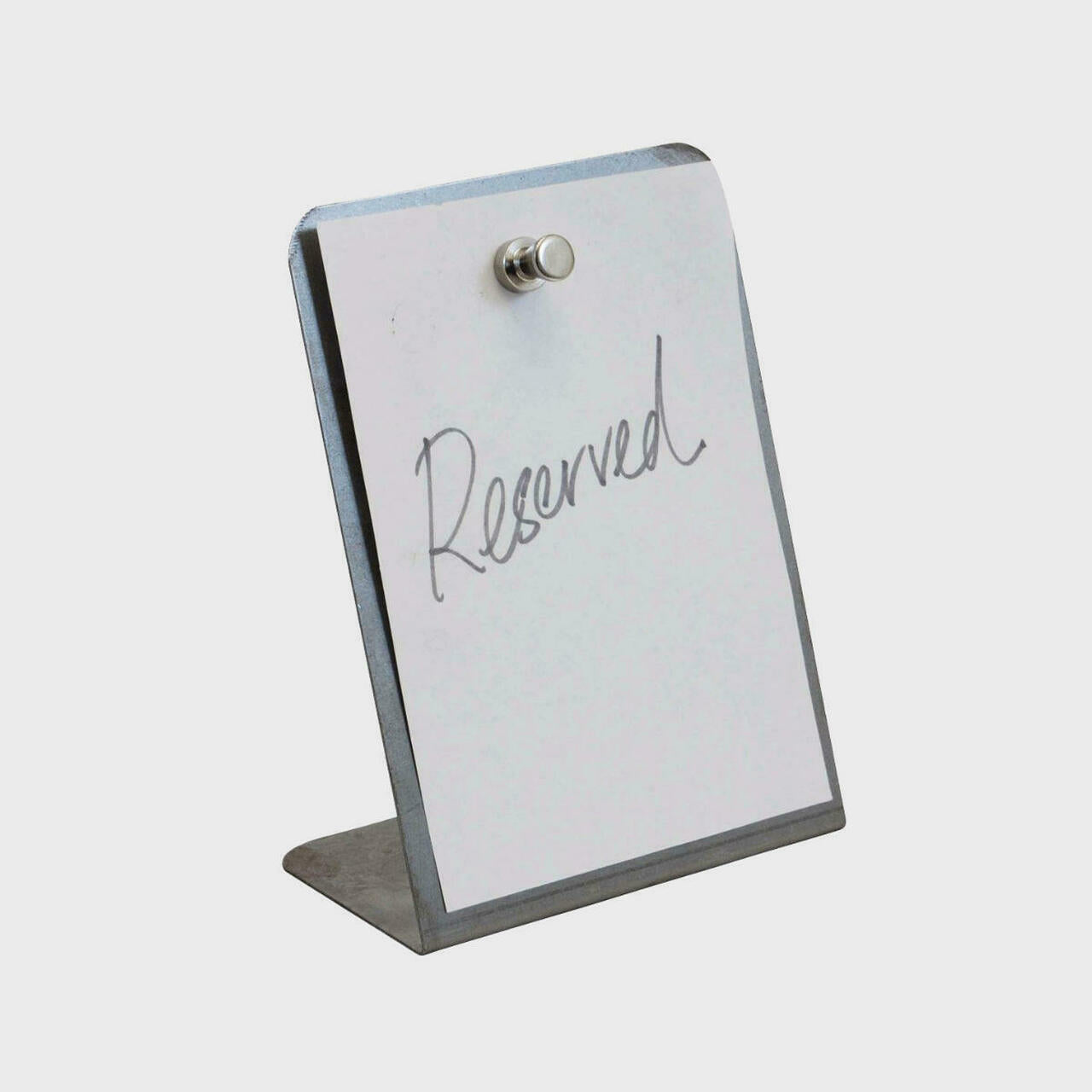 L shaped grey display easel.