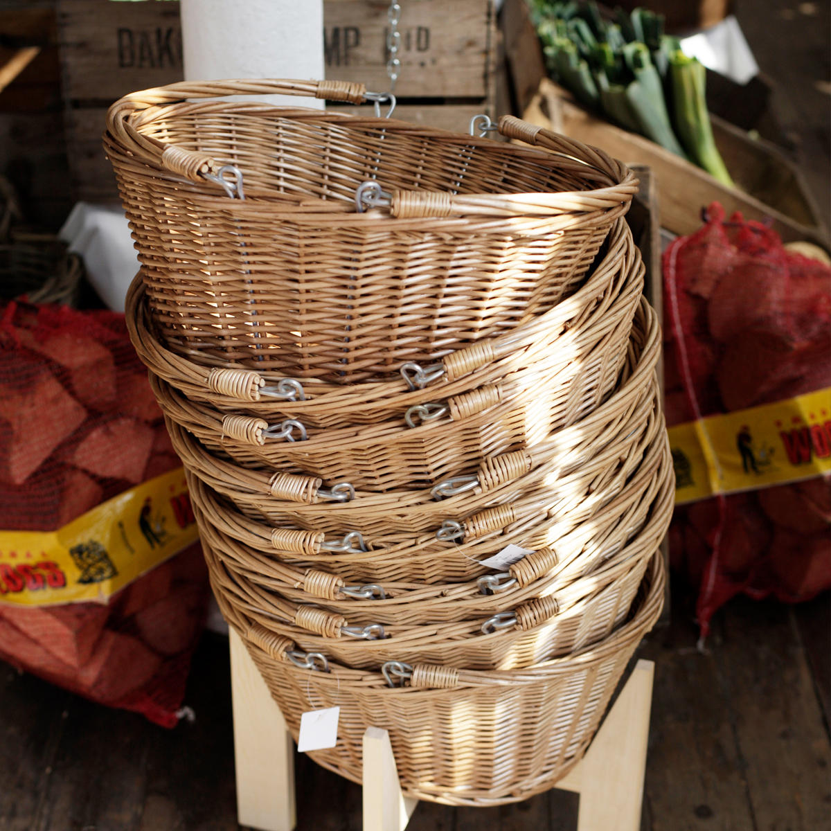 Medium oval natural wicker basket hand-woven from natural split-wicker.
