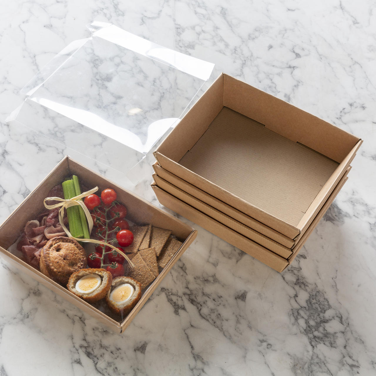 Small kraft half height card tray with structured, low-profile walls and open-top design.