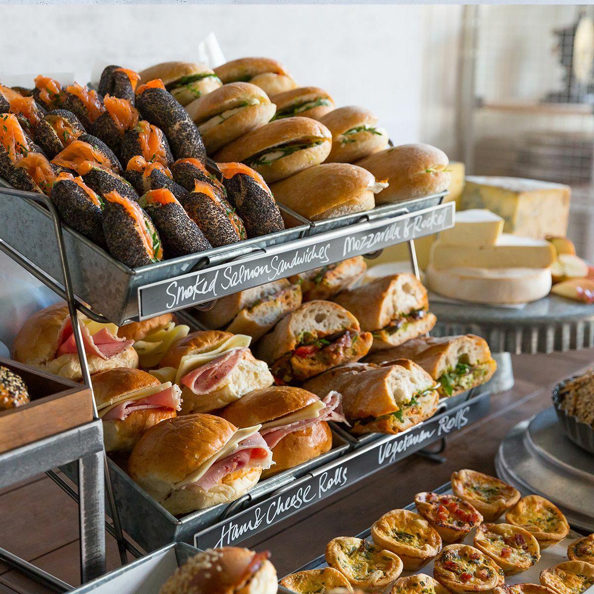 Railton tiered countertop display unit with medium metal trays featuring a multi-tiered layout for product positioning.