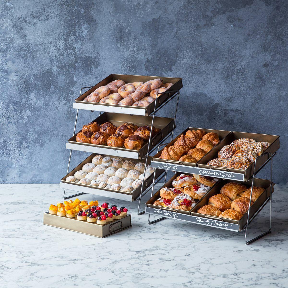 Railton countertop display unit with medium brass metal trays featuring a multi-tiered layout for product positioning.