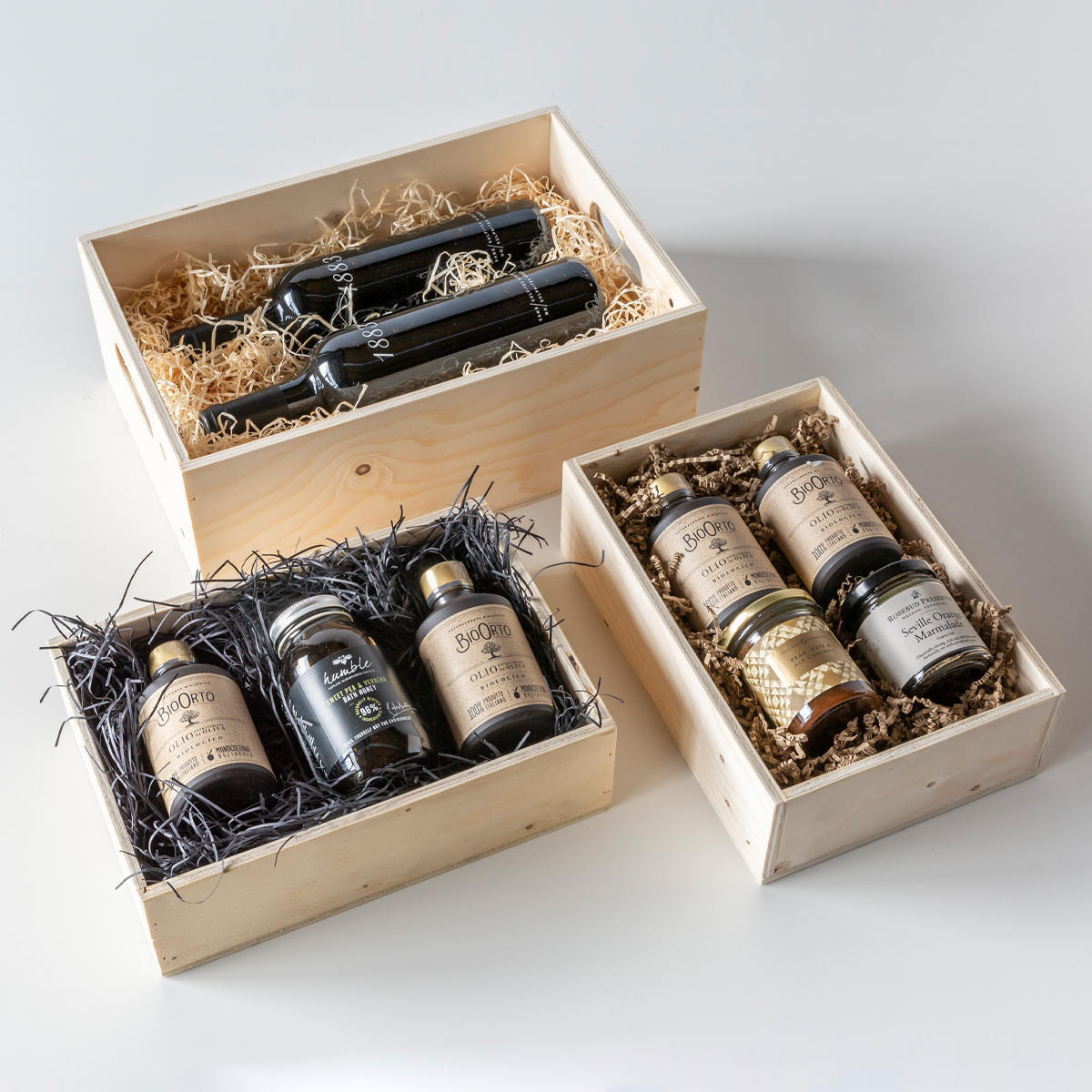Wooden hamper box with drop on lid from high-density rigid paperboard.