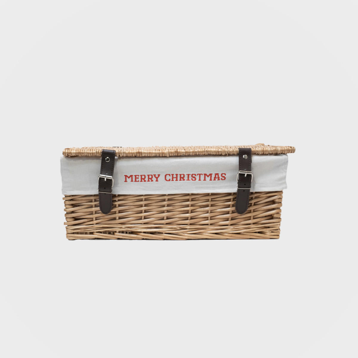 Wicker hamper with embroidered merry christmas liner hand-woven from natural split-wicker.