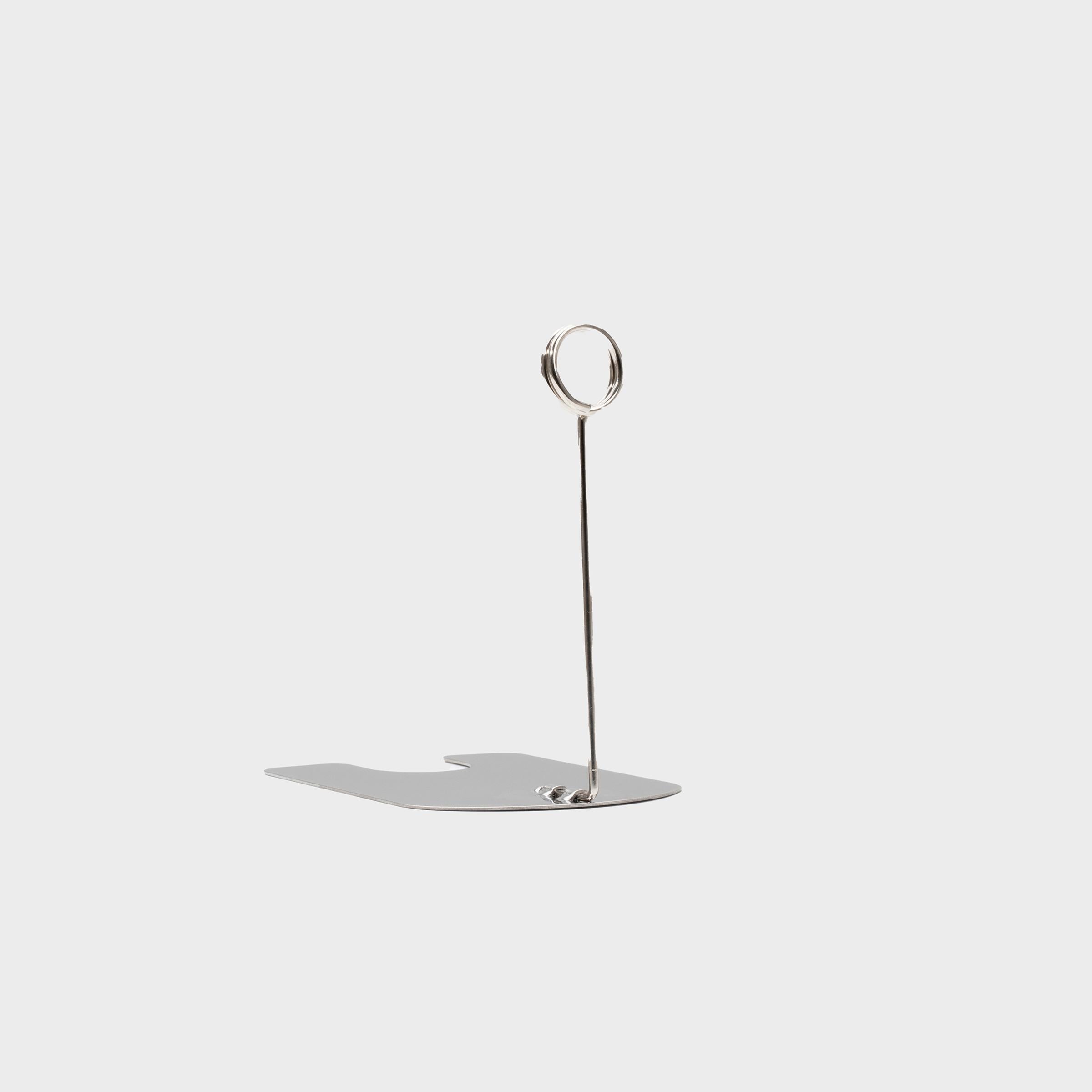 Iron plated chrome ticket holder with a clean surface for visible retail messaging.
