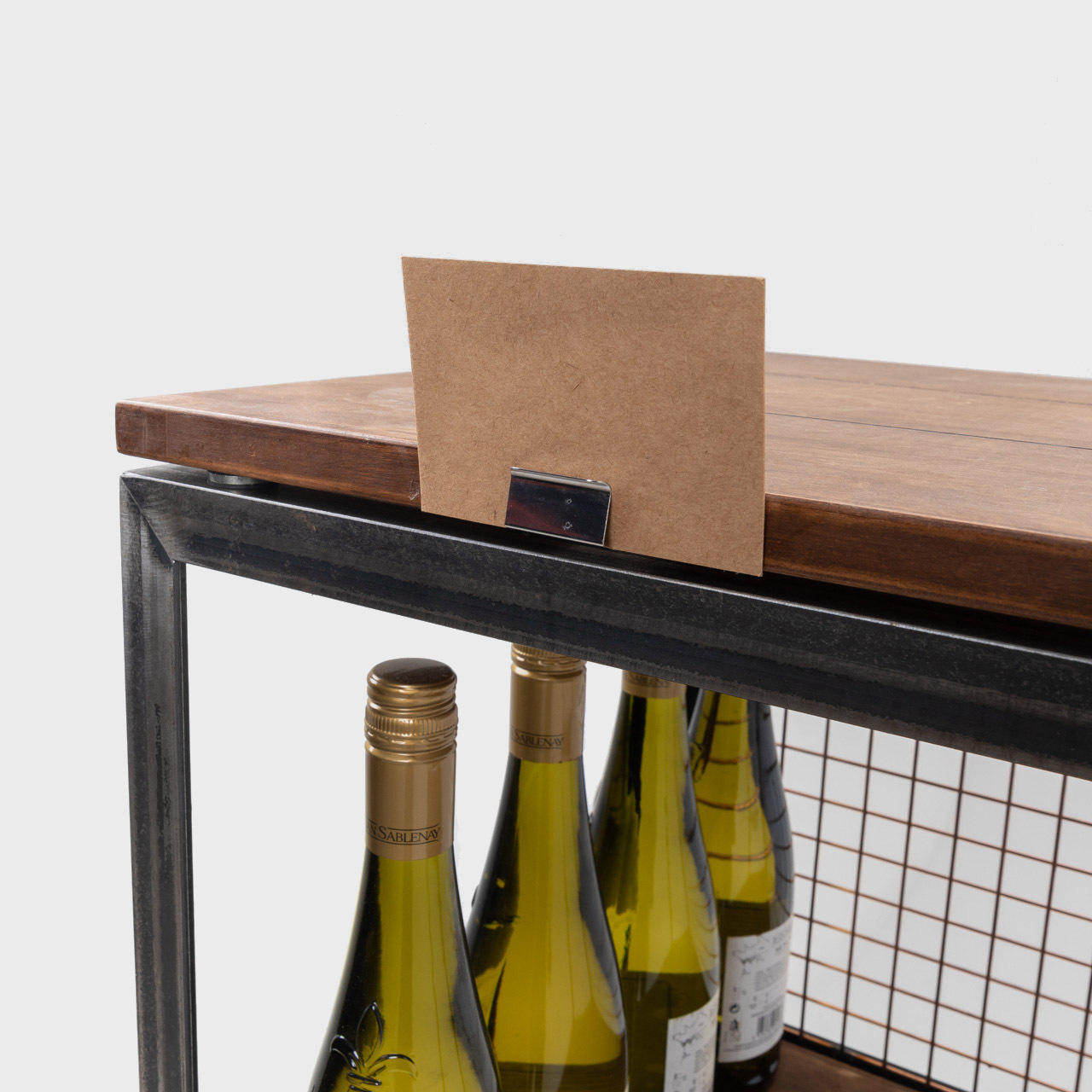 Metal shelf edge ticket holder with a clean surface for visible retail messaging.