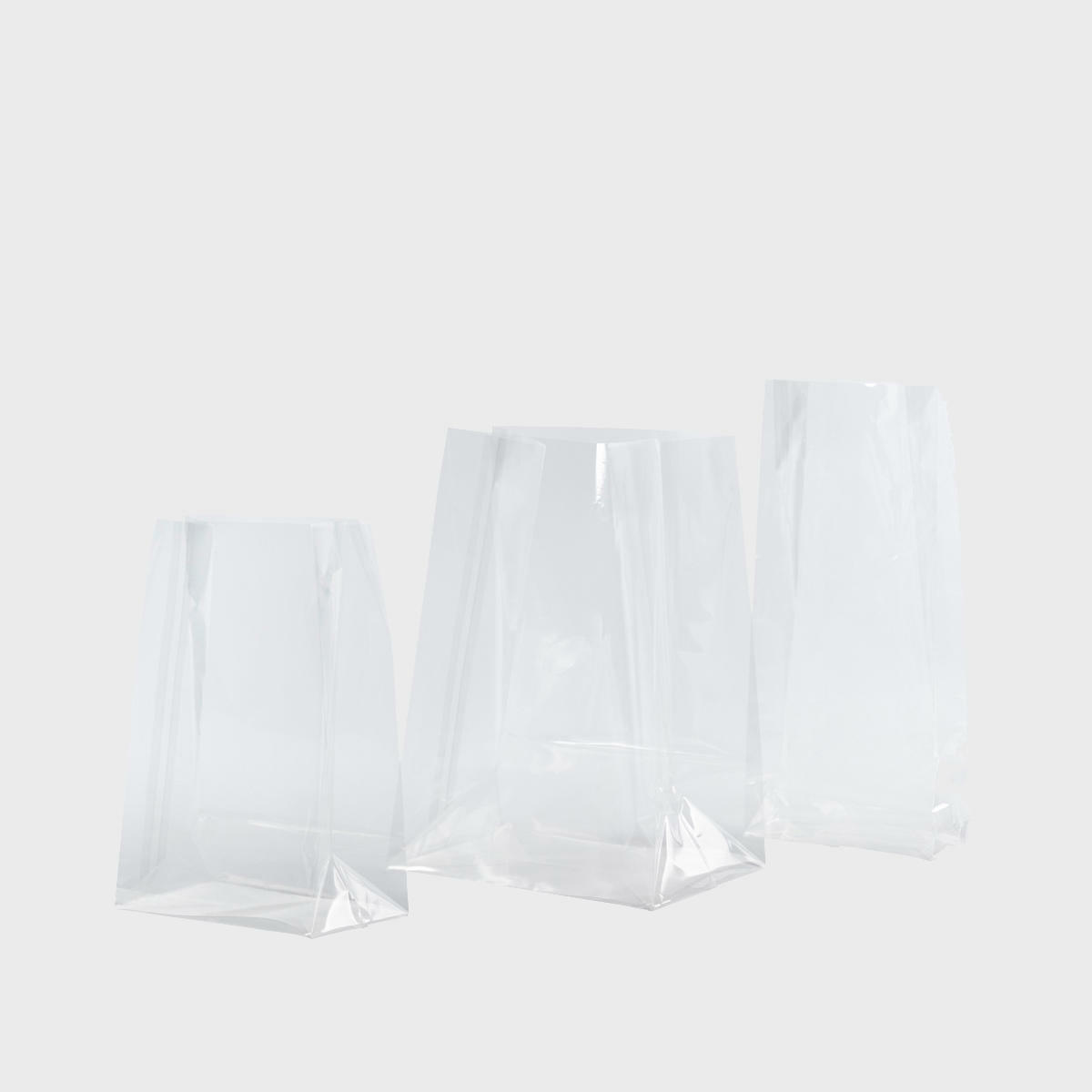 Cellophane gift bag featuring a patterned finish and heavy-duty handles.