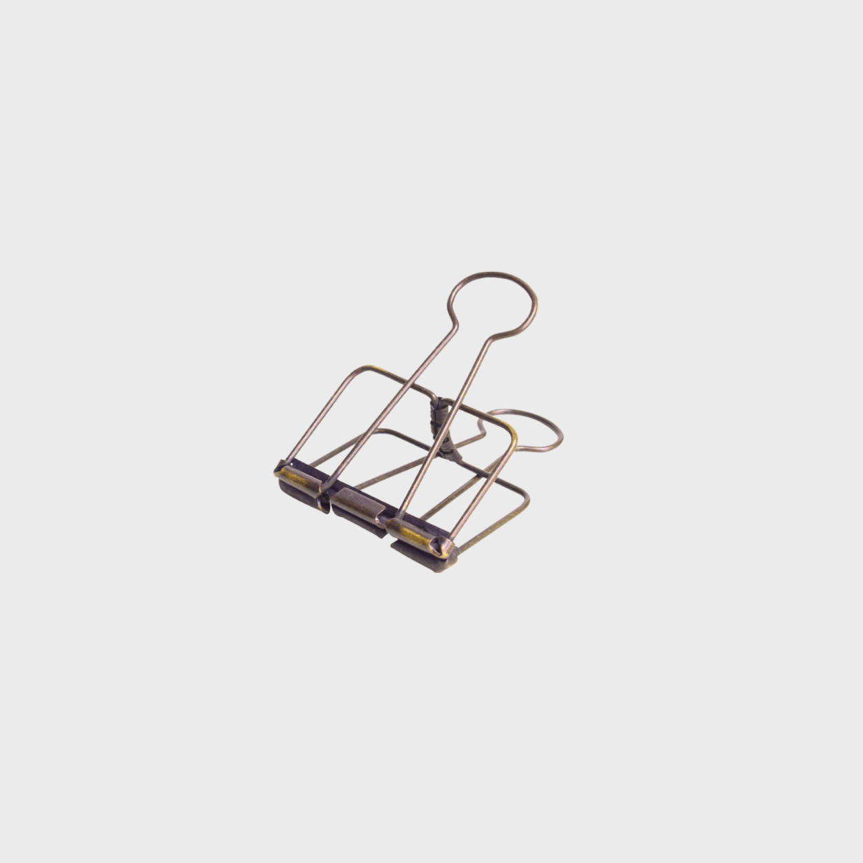 Medium antique brass wire bulldog clip.
