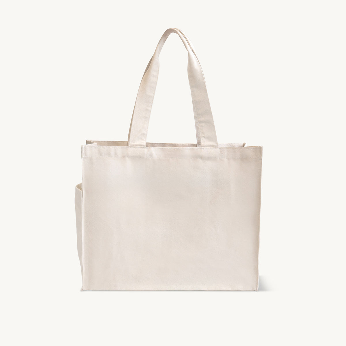 Large natural 12oz washed recycled canvas bag with side pocket.