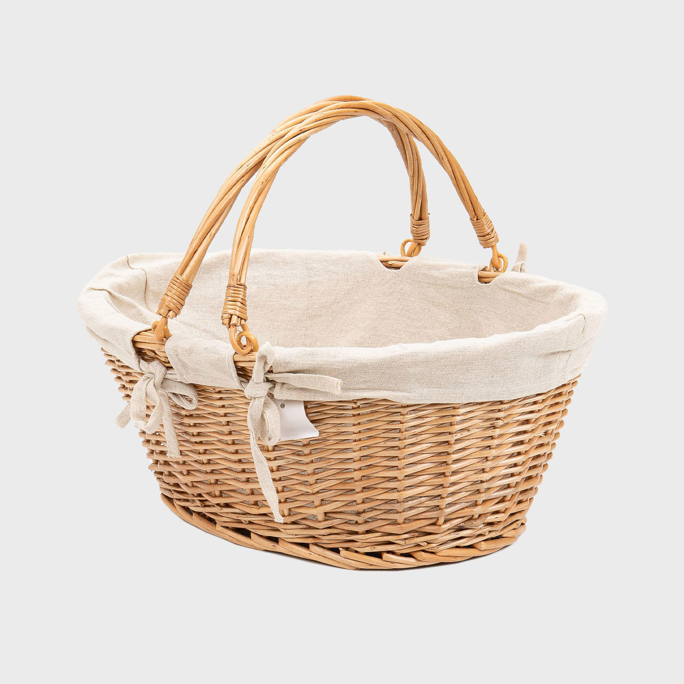 Medium oval natural wicker basket hand-woven from natural split-wicker.