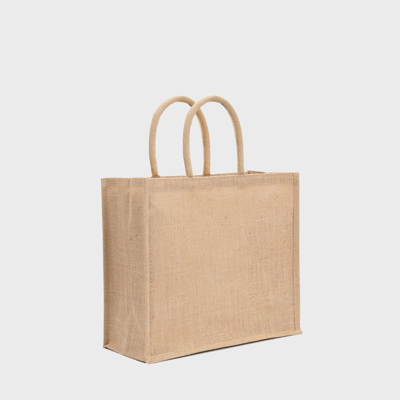 Large natural jute bag with padded handles.