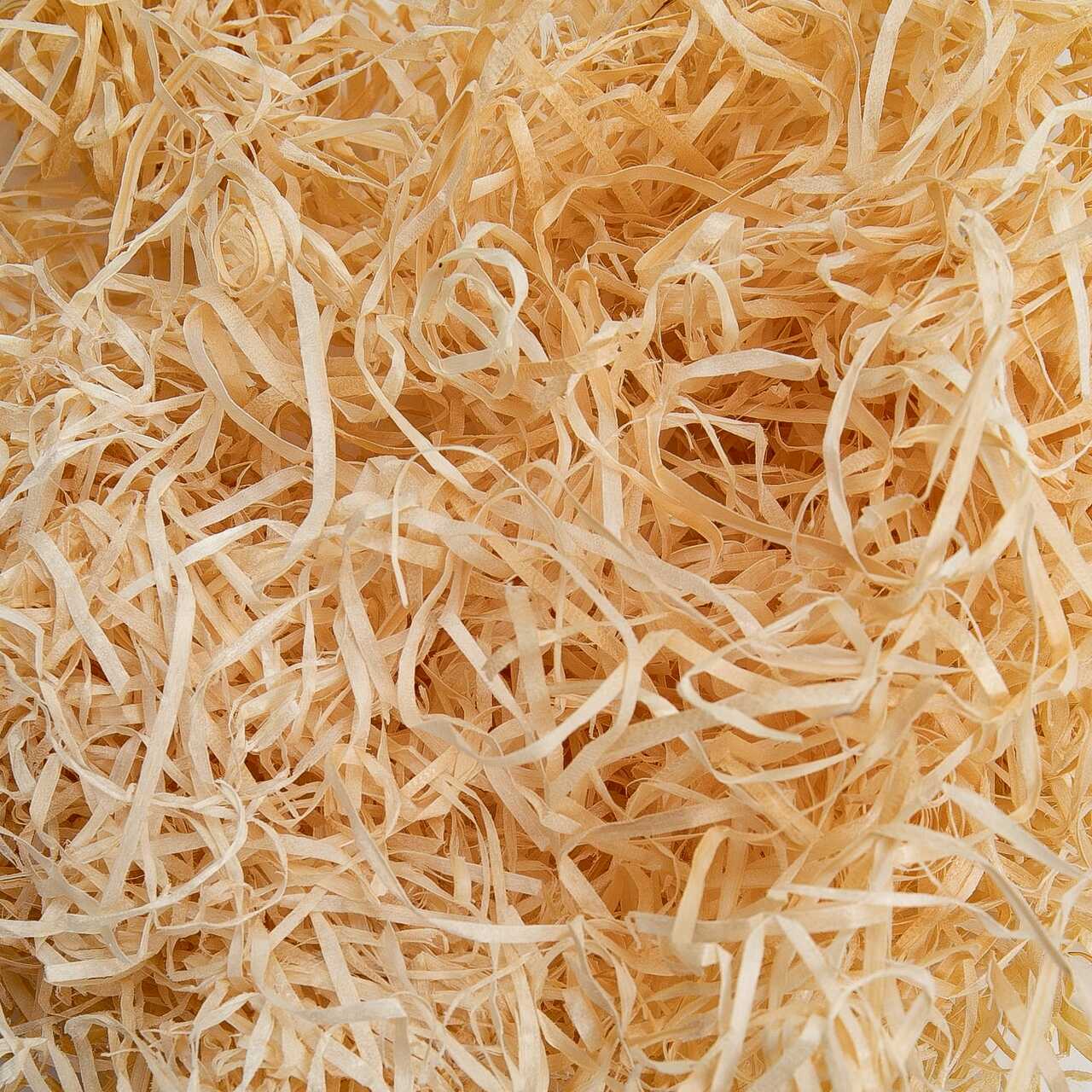 Kiln dried wood wool consisting of interlocking zig-zag paper shreds for fill.