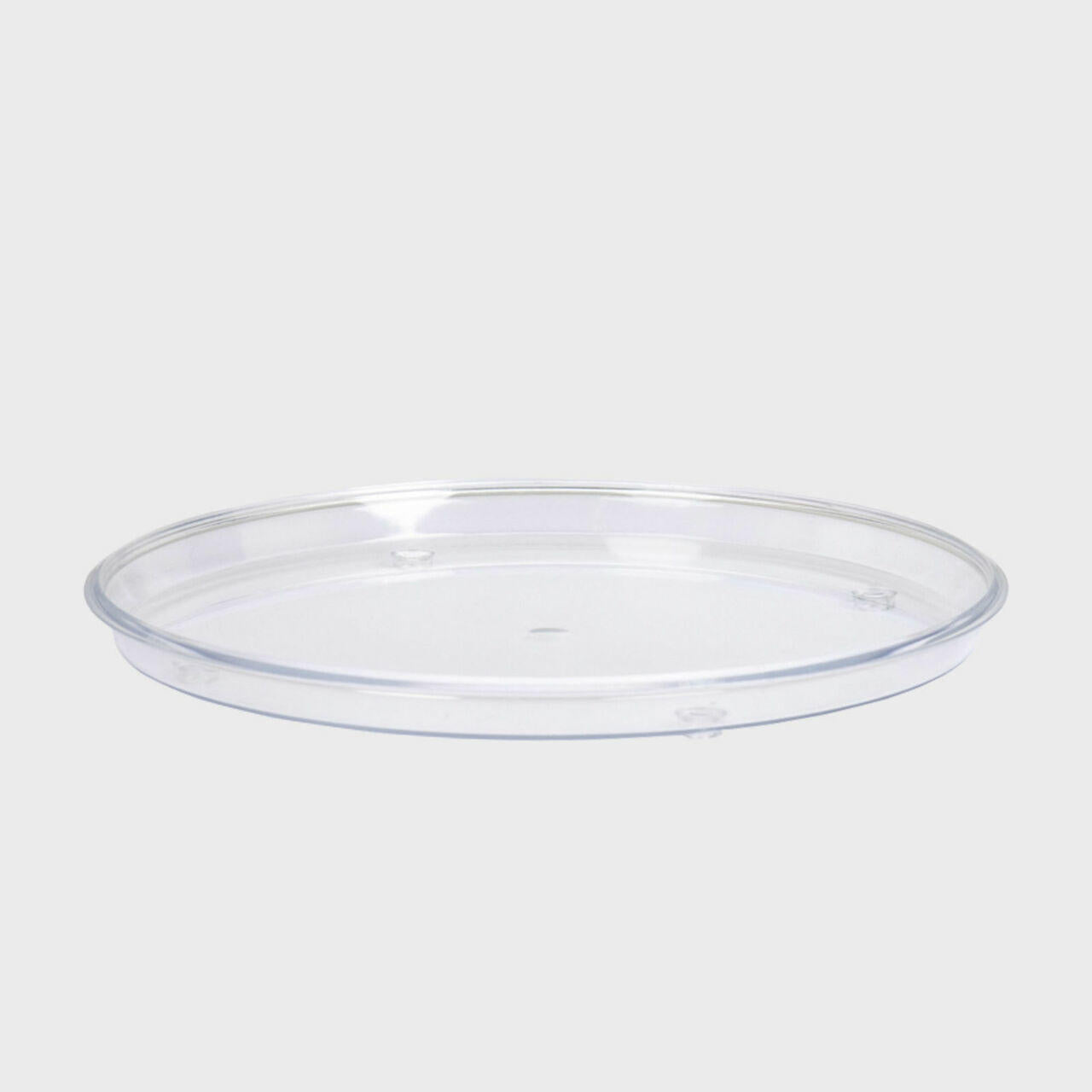 Round acrylic tray with structured, low-profile walls and open-top design.