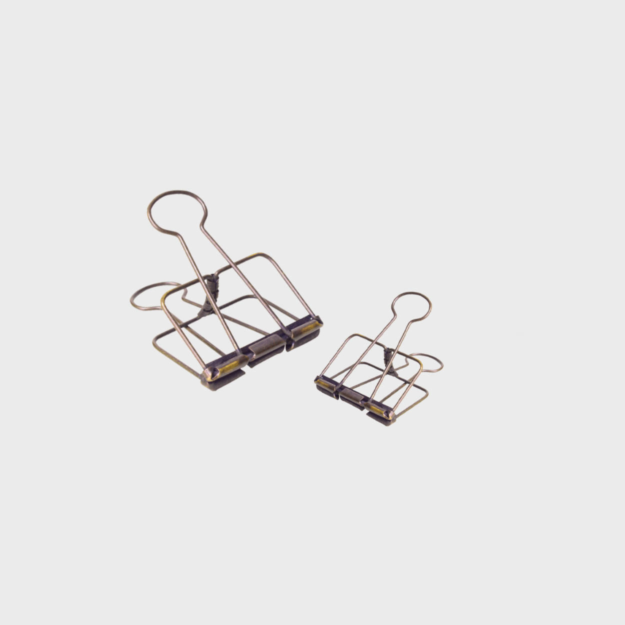 Medium antique brass wire bulldog clip.