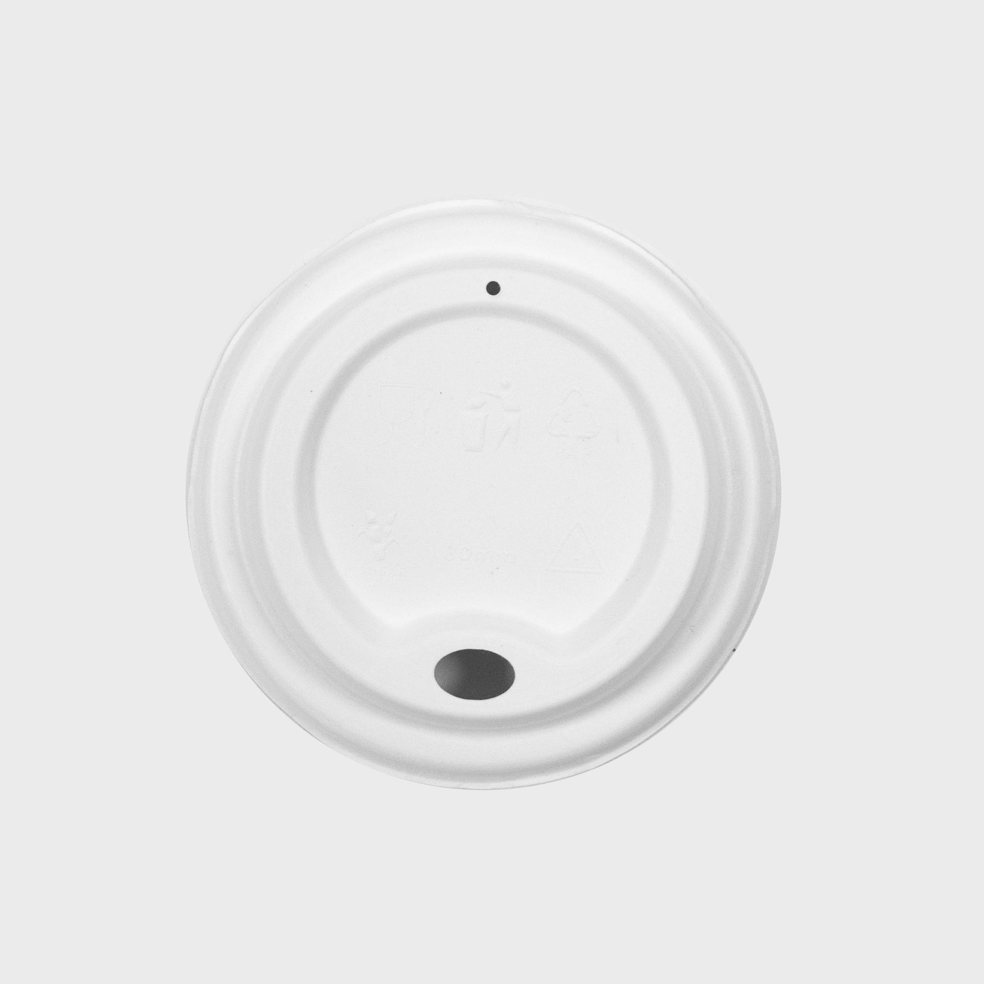 Sugarcane coffee cup lid with eco-friendly, heat-resistant double-wall insulation.