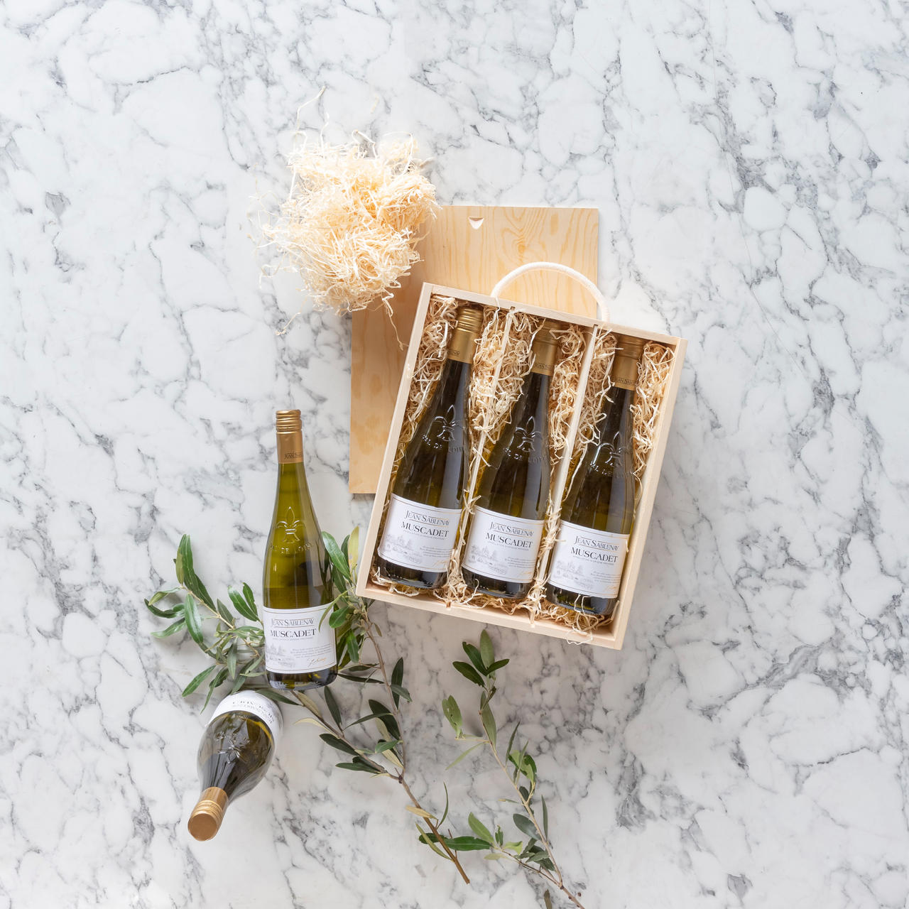 3 Bottle wooden box with rope handle with premium natural wood grain and secure hardware closures.