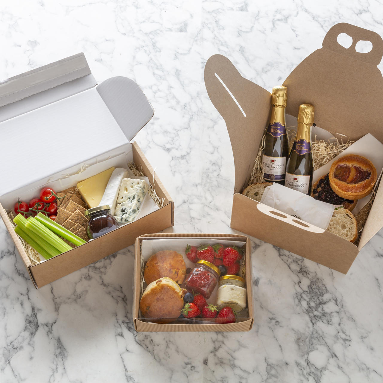 Kraft gift box with clear lid from high-density rigid paperboard.