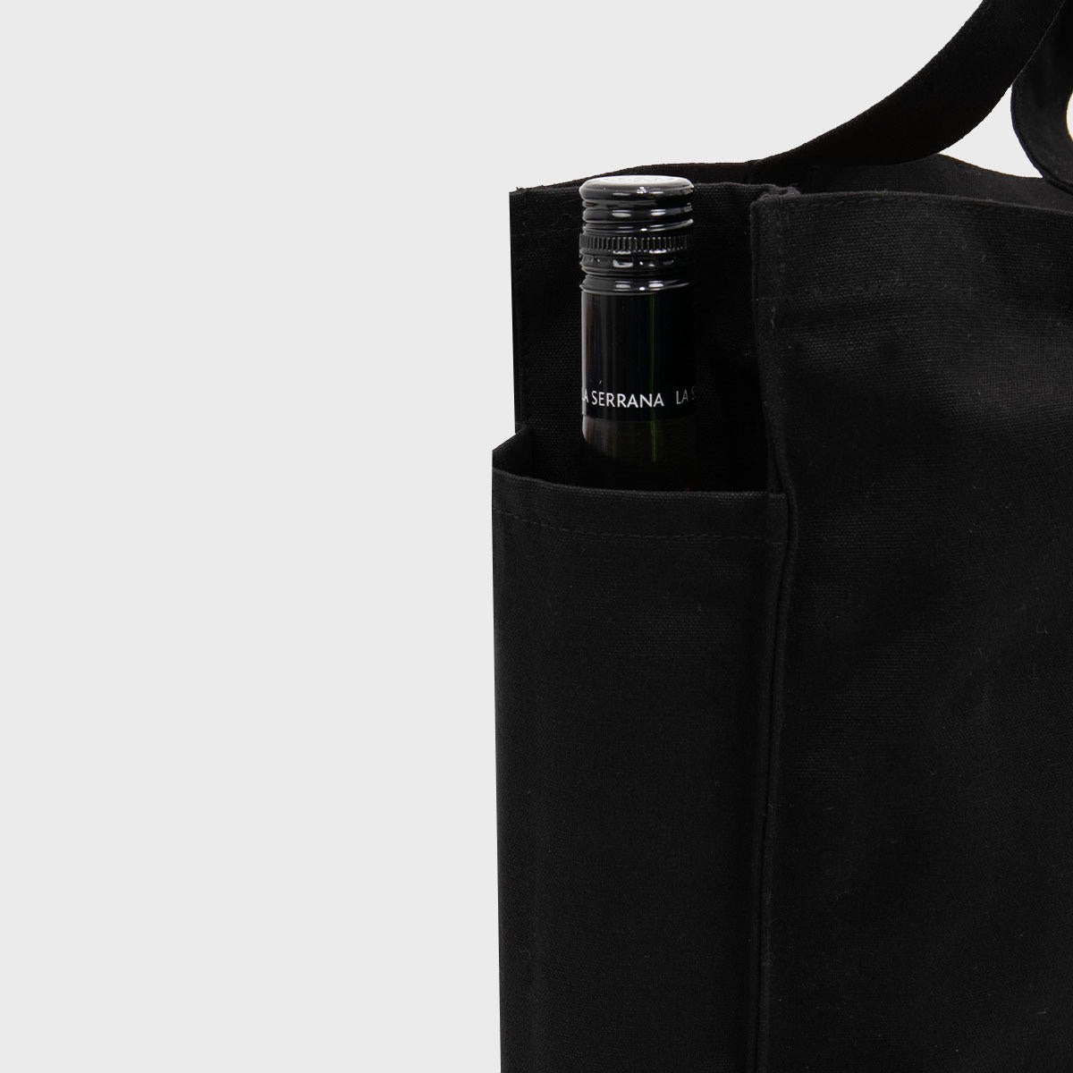 Large black 12oz recycled canvas bag with side pocket.