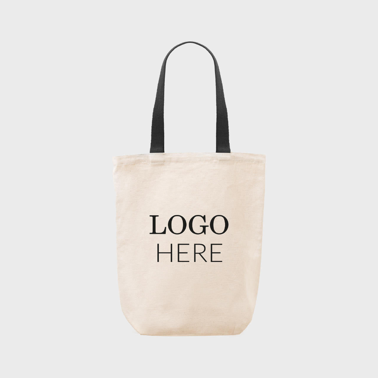 Medium natural 8oz canvas bag with base gusset and black handles professional clean structural profile finish.