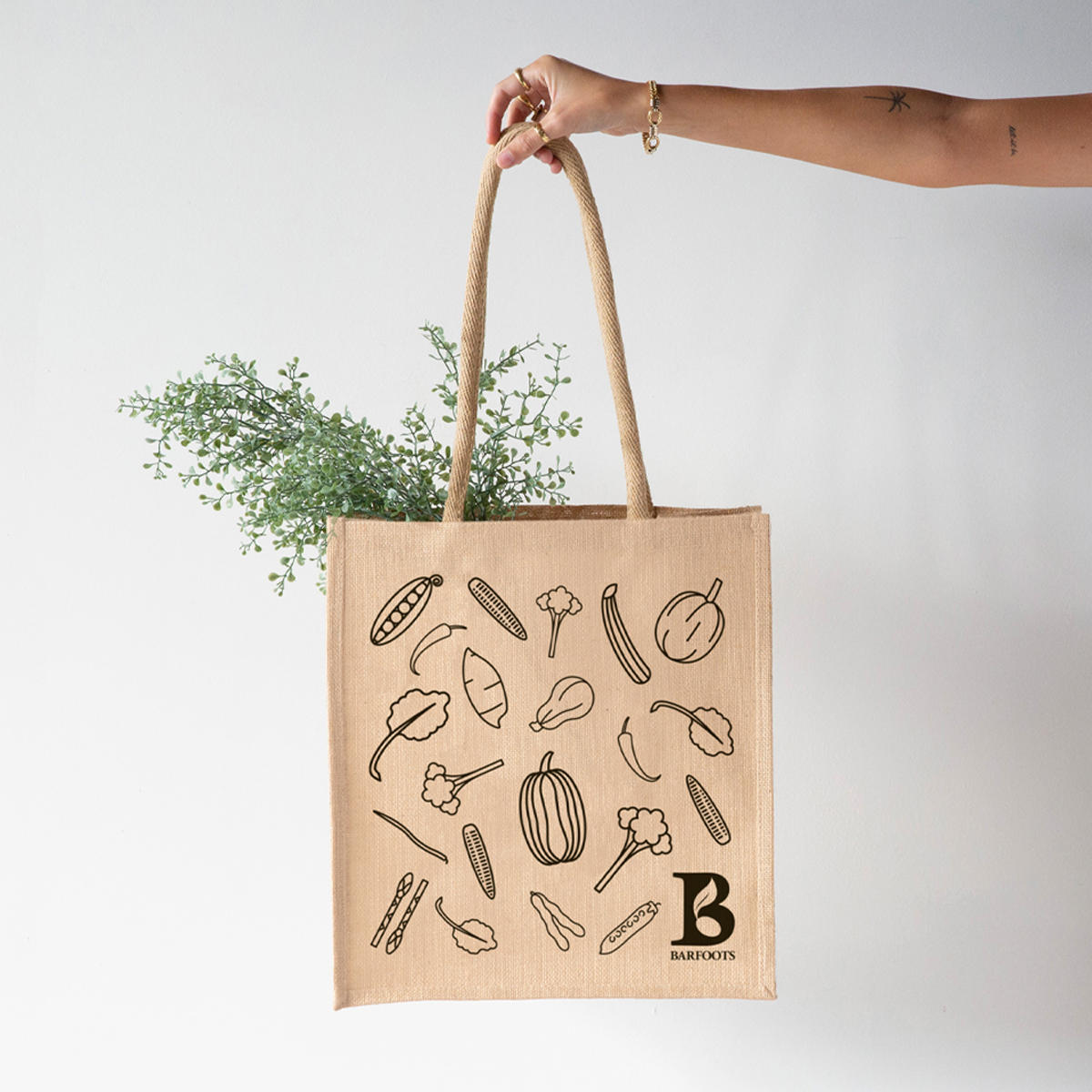Large portrait jute bag with padded handles.