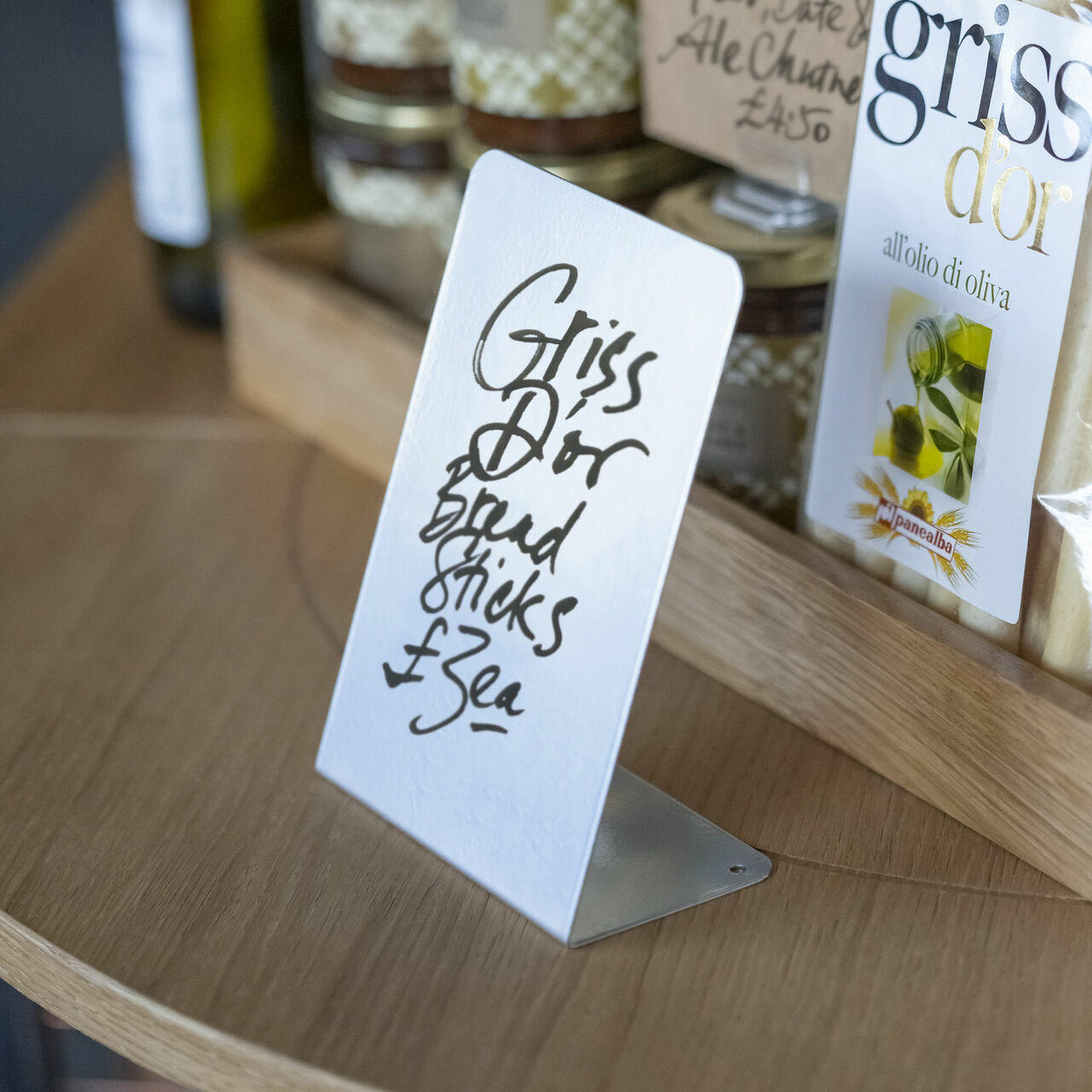 L shaped grey display easel.