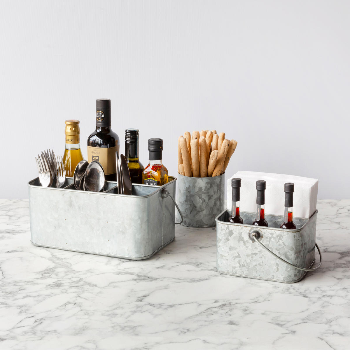 Exmouth large metal display caddy with structured, low-profile walls and open-top design.